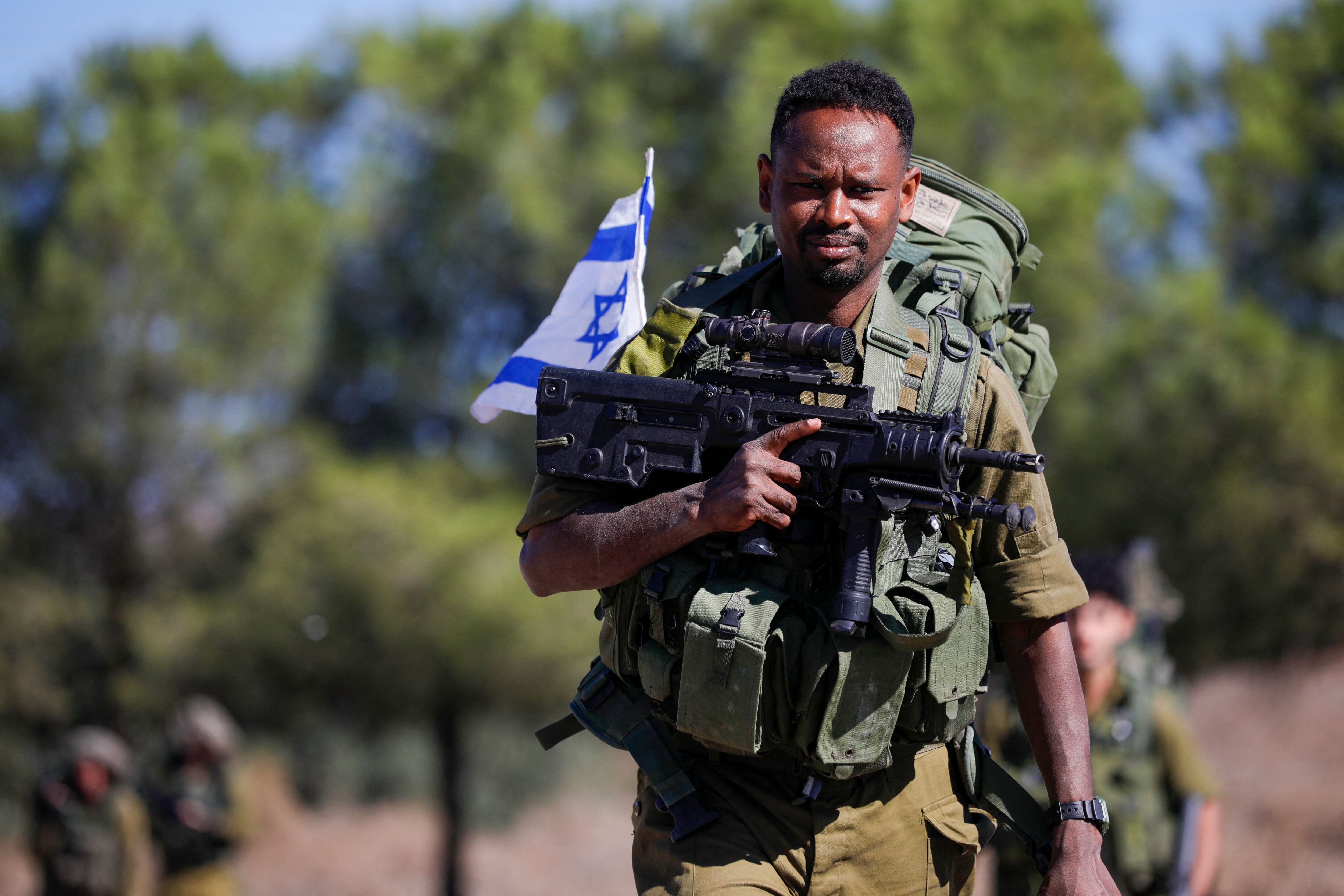 An Israeli solider arrives for a drill in the annexed Golan Heights on November 9, 2023, amid increasing cross-border tensions between Hezbollah and Israel as fighting continues in the south with Hamas militants in the Gaza Strip. (Photo by Jalaa MAREY / AFP) (Photo by JALAA MAREY/AFP via Getty Images)