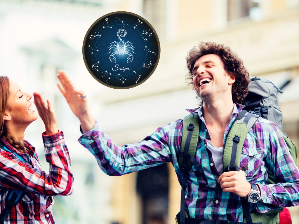 Hombre y mujer chocando la palma de sus manos y demostrando felicidad, de fondo una imagen alusiva al signo Escorpio (Fotos vía Getty Images)