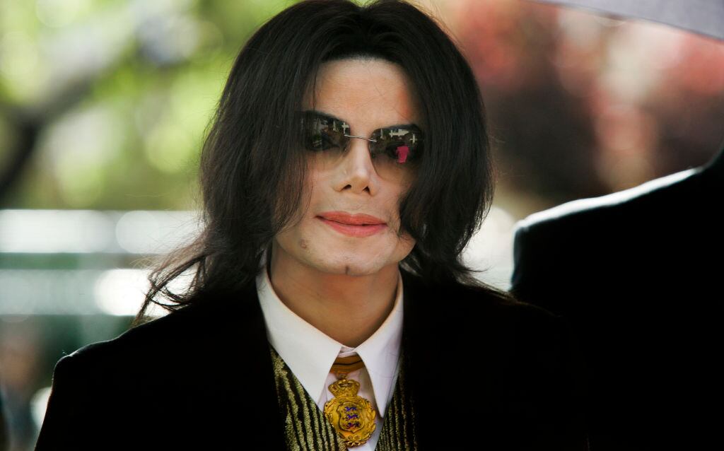 Michael Jackson arrives at a court house during his trial for child molestation in Santa Maria, California. (Photo by Kimberly White/Corbis via Getty Images)