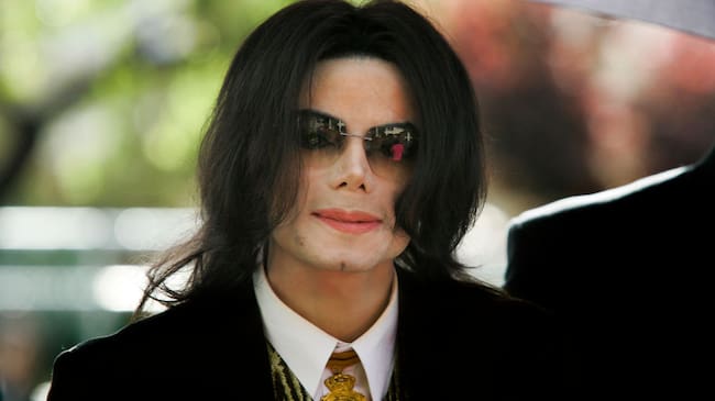 Michael Jackson arrives at a court house during his trial for child molestation in Santa Maria, California. (Photo by Kimberly White/Corbis via Getty Images)