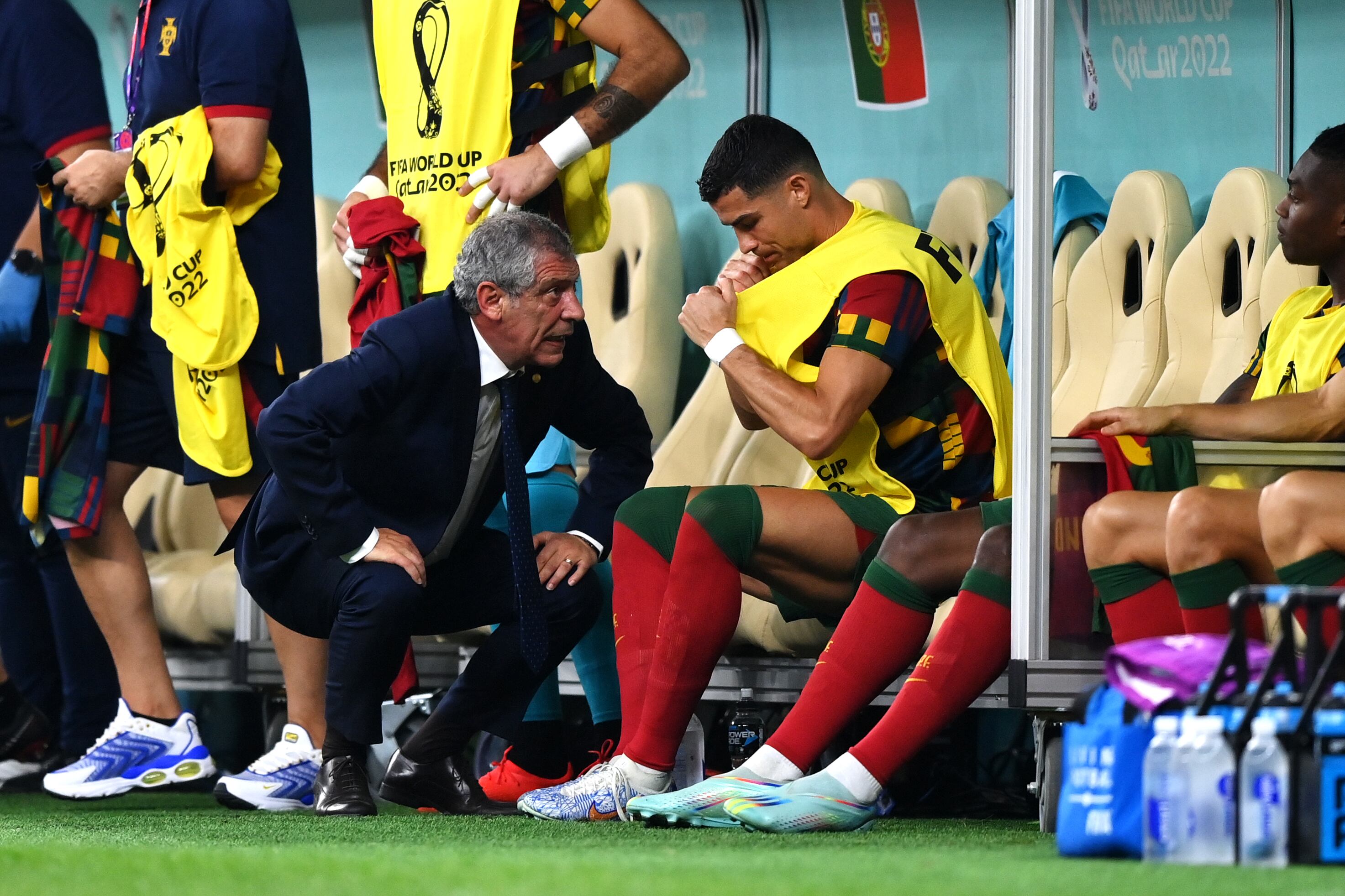 LUSAIL CITY, QATAR - DECEMBER 06: Fernando Santos, Head Coach of Portugal, speaks with Cristiano Ronaldo before a substitution during the FIFA World Cup Qatar 2022 Round of 16 match between Portugal and Switzerland at Lusail Stadium on December 06, 2022 in Lusail City, Qatar. (Photo by Justin Setterfield/Getty Images)