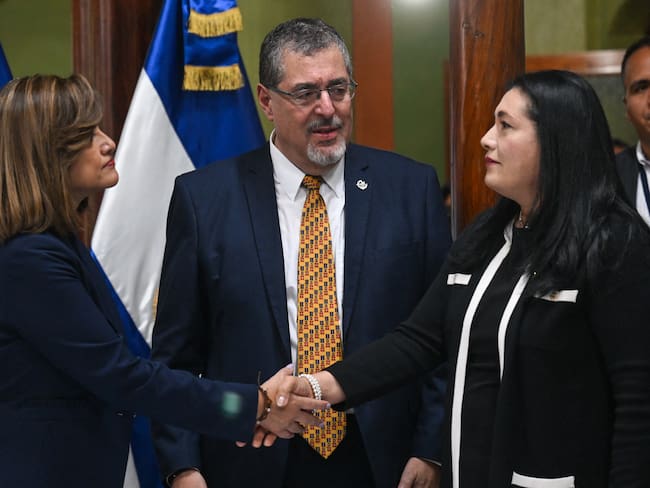 Guatemalan President-elect Bernardo Arevalo (C) looks at his Vice President-elect Karin Herrera (L) shaking hands with the magistrate of the Supreme Electoral Tribunal's Blanca Alfaro during a meeting at the headquarters of the Supreme Electoral Tribunal in Guatemala City on October 2, 2023. The United States on Sunday strongly condemned Guatemalan prosecutors' seizure of materials from the country's election court, a move it said "undermines" a peaceful transition of power after this year's presidential elections. Guatemalan prosecutors seized electoral materials under the custody of the Supreme Electoral Tribunal (TSE) allegedly to investigate supposed voting irregularities. (Photo by Johan ORDONEZ / AFP) (Photo by JOHAN ORDONEZ/AFP via Getty Images)