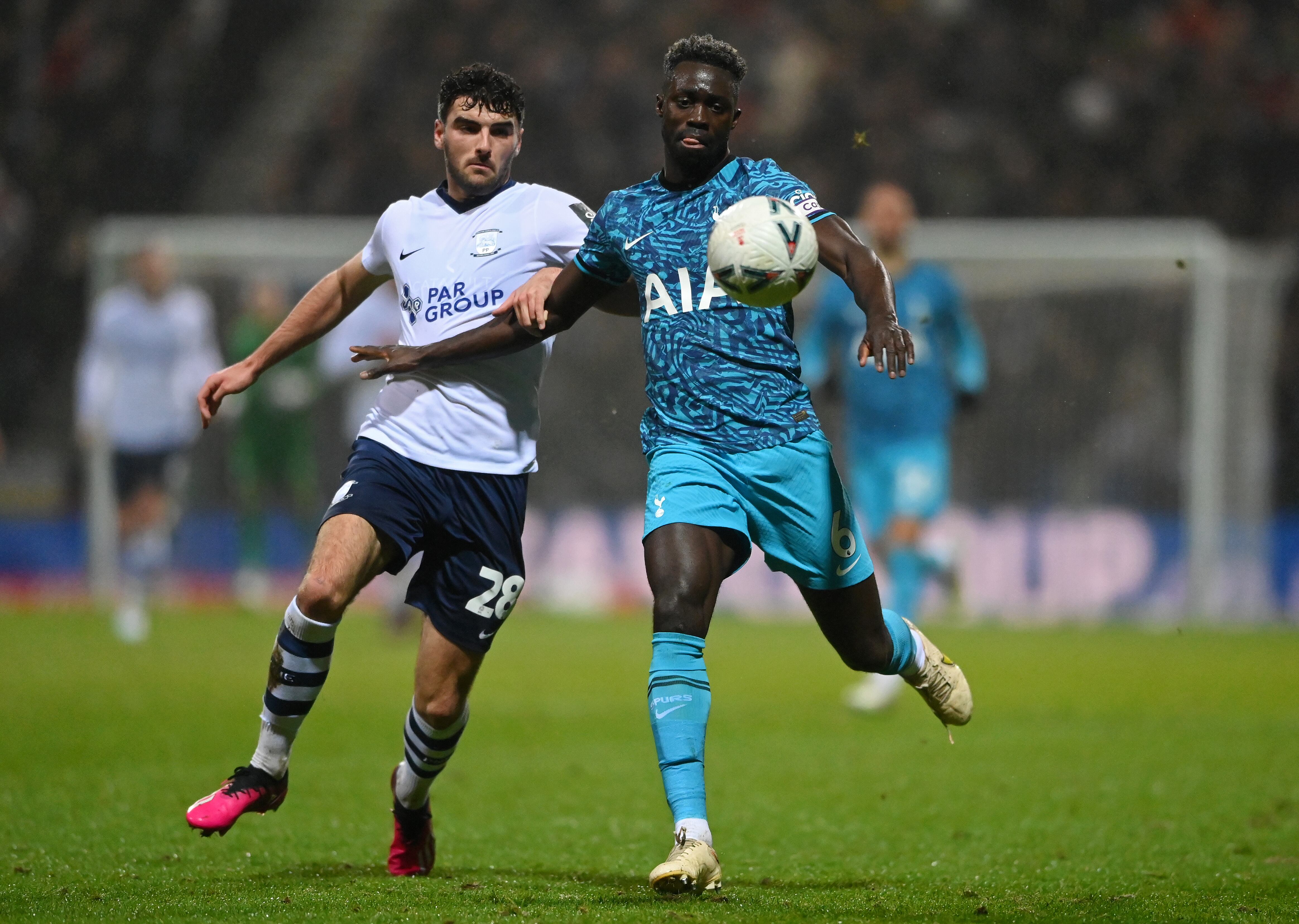 PRESTON, ENGLAND - JANUARY 28: Thomas Cannon of Preston North End battles for possession with Davinson Sanchez of Tottenham Hotspur during the Emirates FA Cup Fourth Round match between Preston North End and Tottenham Hotspur at Deepdale on January 28, 2023 in Preston, England. (Photo by Stu Forster/Getty Images)
