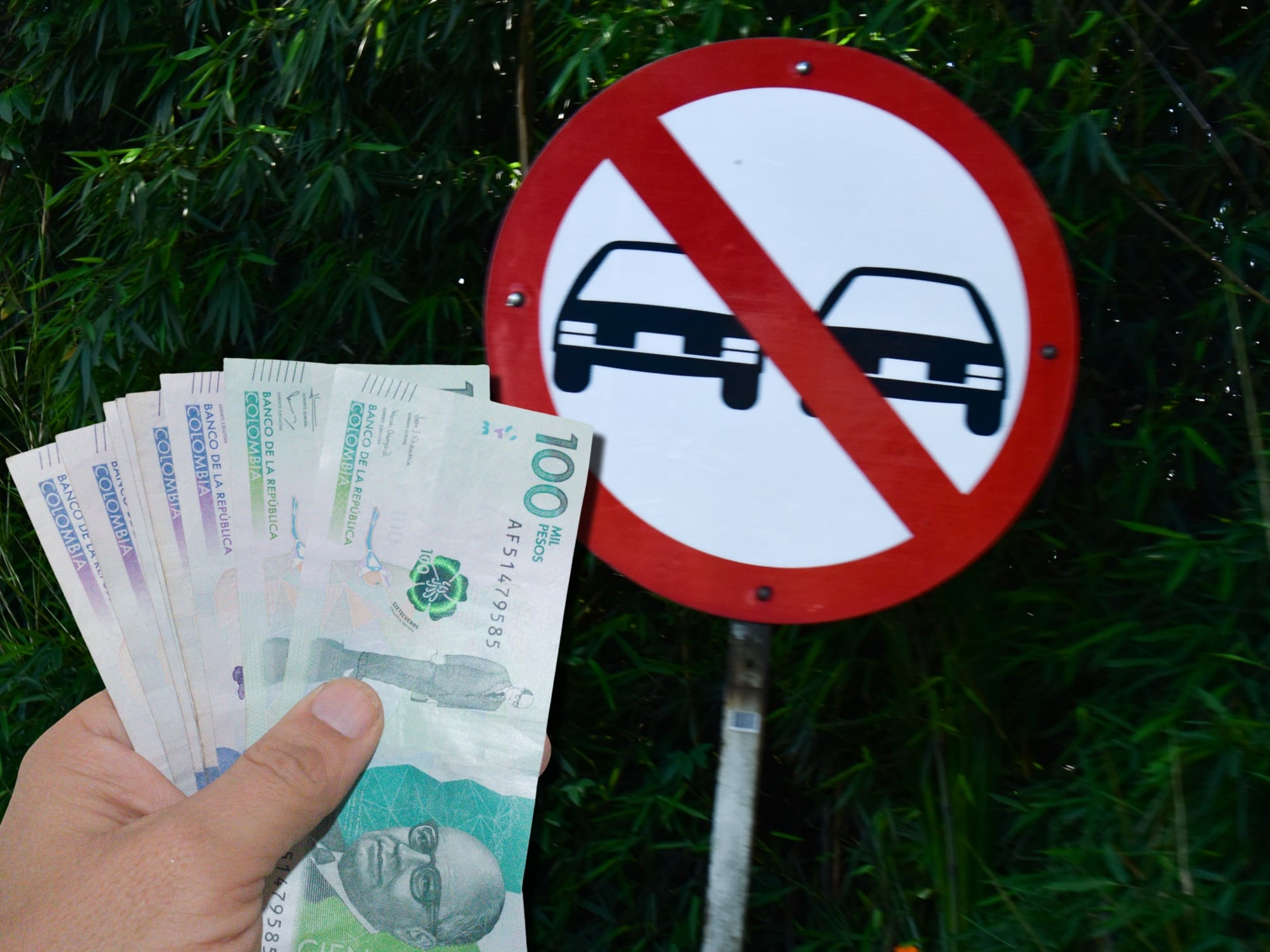 Señal de tránsito de prohibido adelantar. Al frente, dinero colombiano. Fotos: Getty Images.