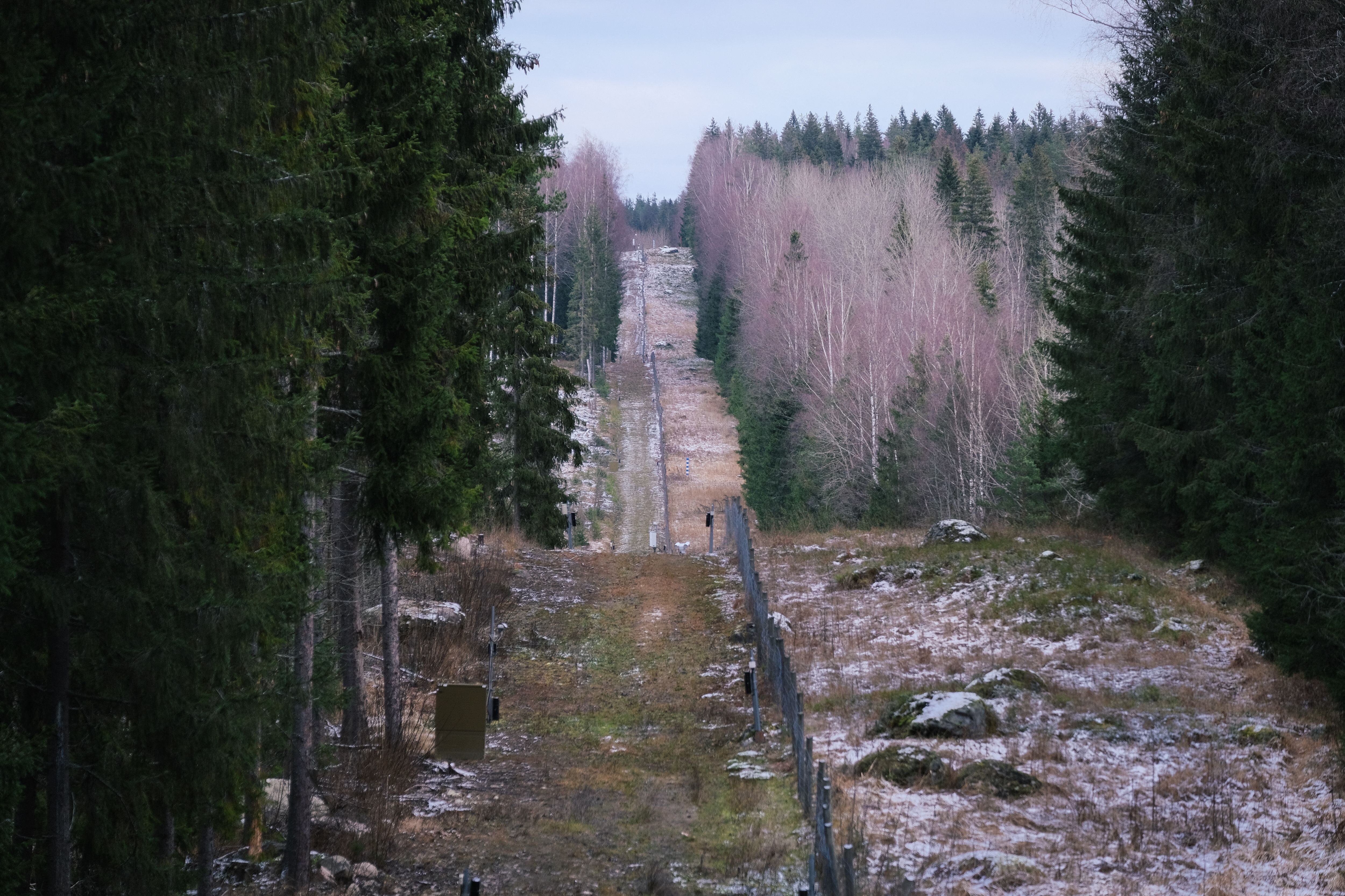 A fence among forests marking the boundary area between Finland and the Russian Federation is pictured near the border crossing of Pelkola, in Imatra, Finland on November 18, 2022. - Finland unveiled on November 18, 2022 a plan to increase security on its border with Russia, including a 200-kilometre (124-mile) fence, after the invasion of Ukraine sparked tensions along the border. (Photo by Alessandro RAMPAZZO / AFP) (Photo by ALESSANDRO RAMPAZZO/AFP via Getty Images)