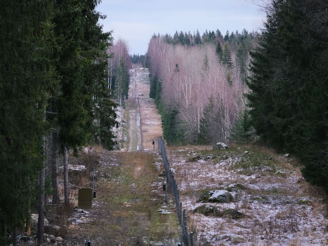 A fence among forests marking the boundary area between Finland and the Russian Federation is pictured near the border crossing of Pelkola, in Imatra, Finland on November 18, 2022. - Finland unveiled on November 18, 2022 a plan to increase security on its border with Russia, including a 200-kilometre (124-mile) fence, after the invasion of Ukraine sparked tensions along the border. (Photo by Alessandro RAMPAZZO / AFP) (Photo by ALESSANDRO RAMPAZZO/AFP via Getty Images)