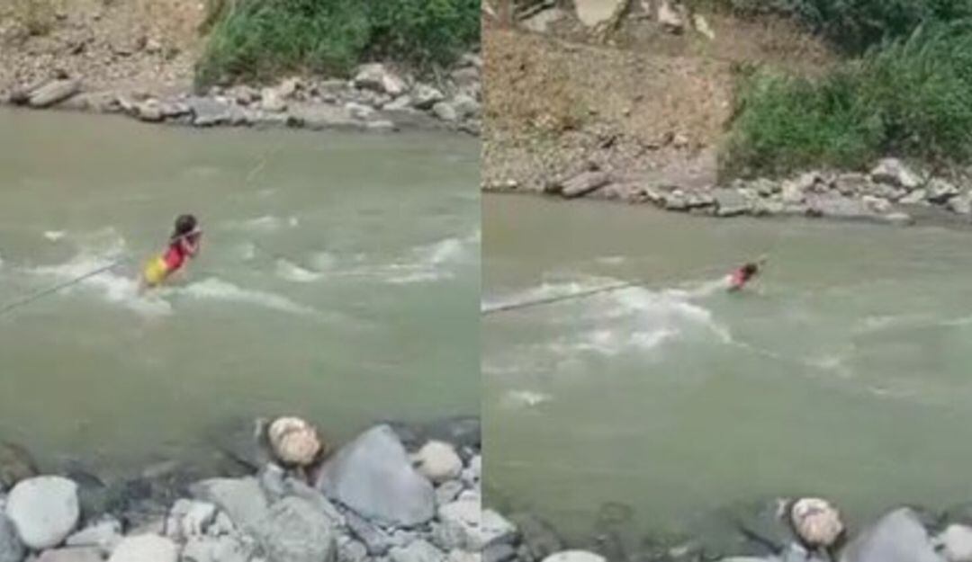 Menor indígena intentando cruzar le río.