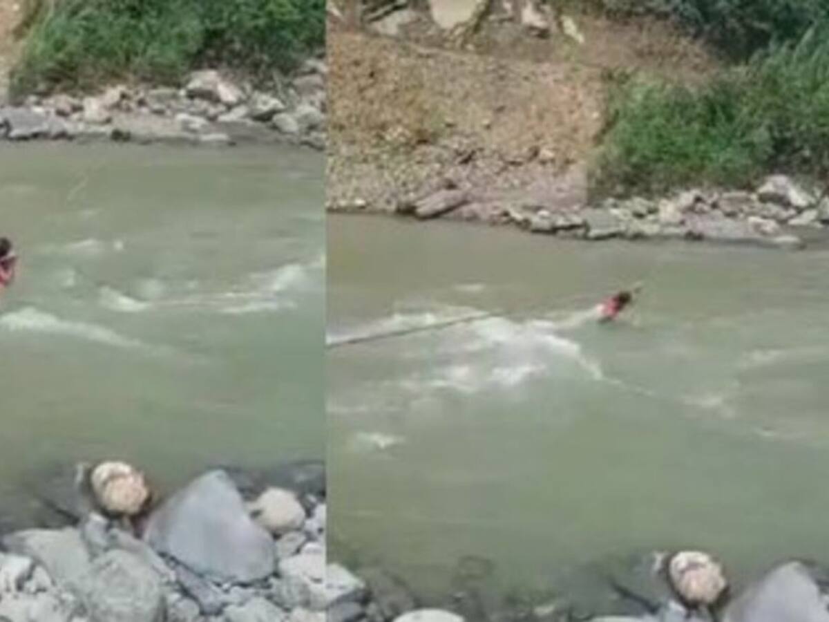 Indignación por video de niña cruzando un río de Pueblo Rico con una cuerda