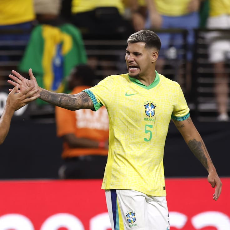 Las Vegas (United States), 29/06/2024.- Brazil midfielder Lucas Paqueta (L) high fives teammate Bruno Guimarães (R) after Parqueta scored a goal on a penalty kick during the second half of the CONMEBOL Copa America 2024 group D soccer match between Paraguay and Brazil, in Las Vegas, Nevada, USA, 28 June 2024. (Brasil) EFE/EPA/CAROLINE BREHMAN