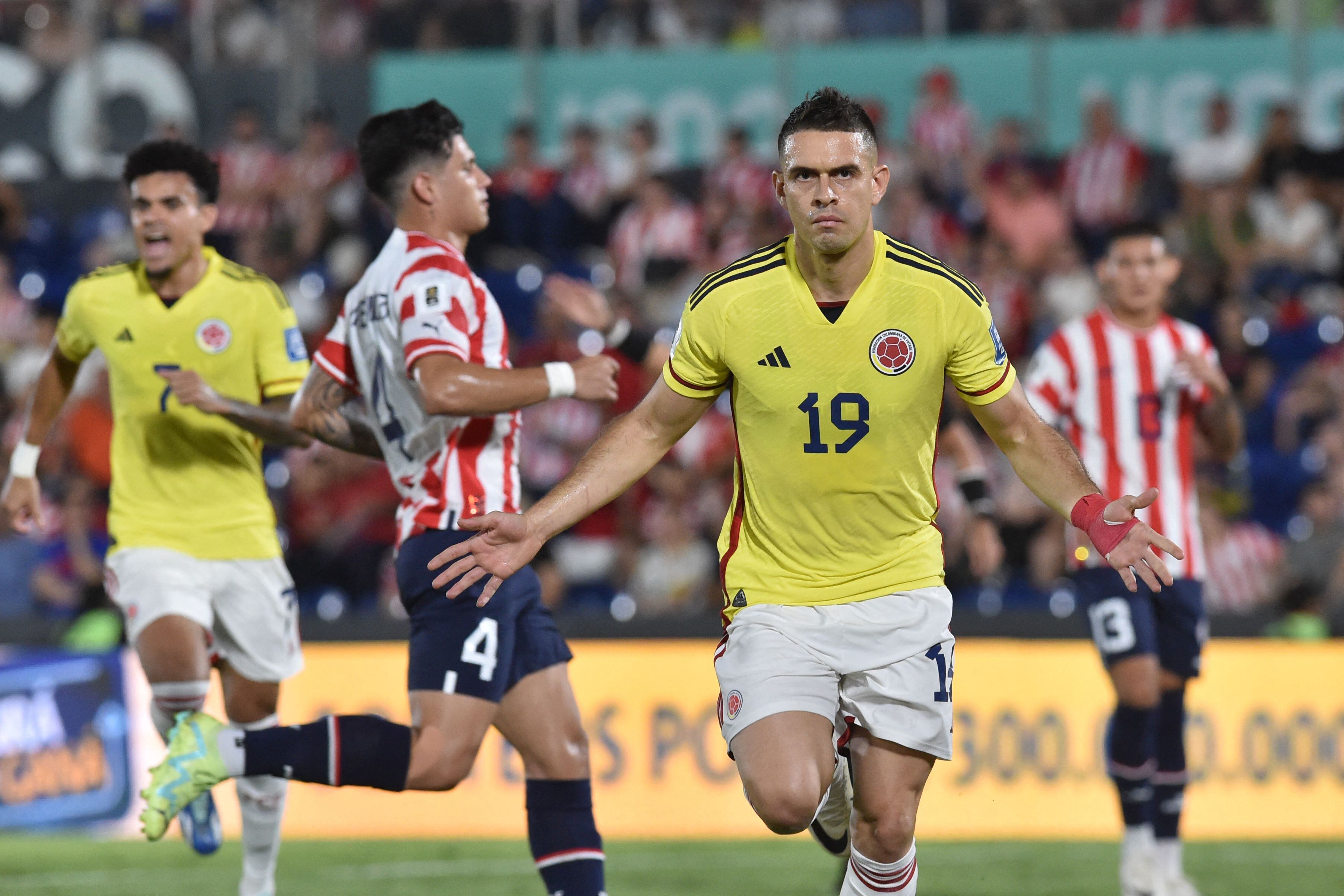 Colombia's forward Rafael Santos Borre (C) celebrates after scoring a penalty during the 2026 FIFA World Cup South American qualifiers football match between Paraguay and Colombia at the Defensores del Chaco stadium in Asuncion on November 21, 2023. (Photo by NORBERTO DUARTE / AFP) (Photo by NORBERTO DUARTE/AFP via Getty Images)