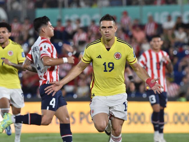 Colombia's forward Rafael Santos Borre (C) celebrates after scoring a penalty during the 2026 FIFA World Cup South American qualifiers football match between Paraguay and Colombia at the Defensores del Chaco stadium in Asuncion on November 21, 2023. (Photo by NORBERTO DUARTE / AFP) (Photo by NORBERTO DUARTE/AFP via Getty Images)