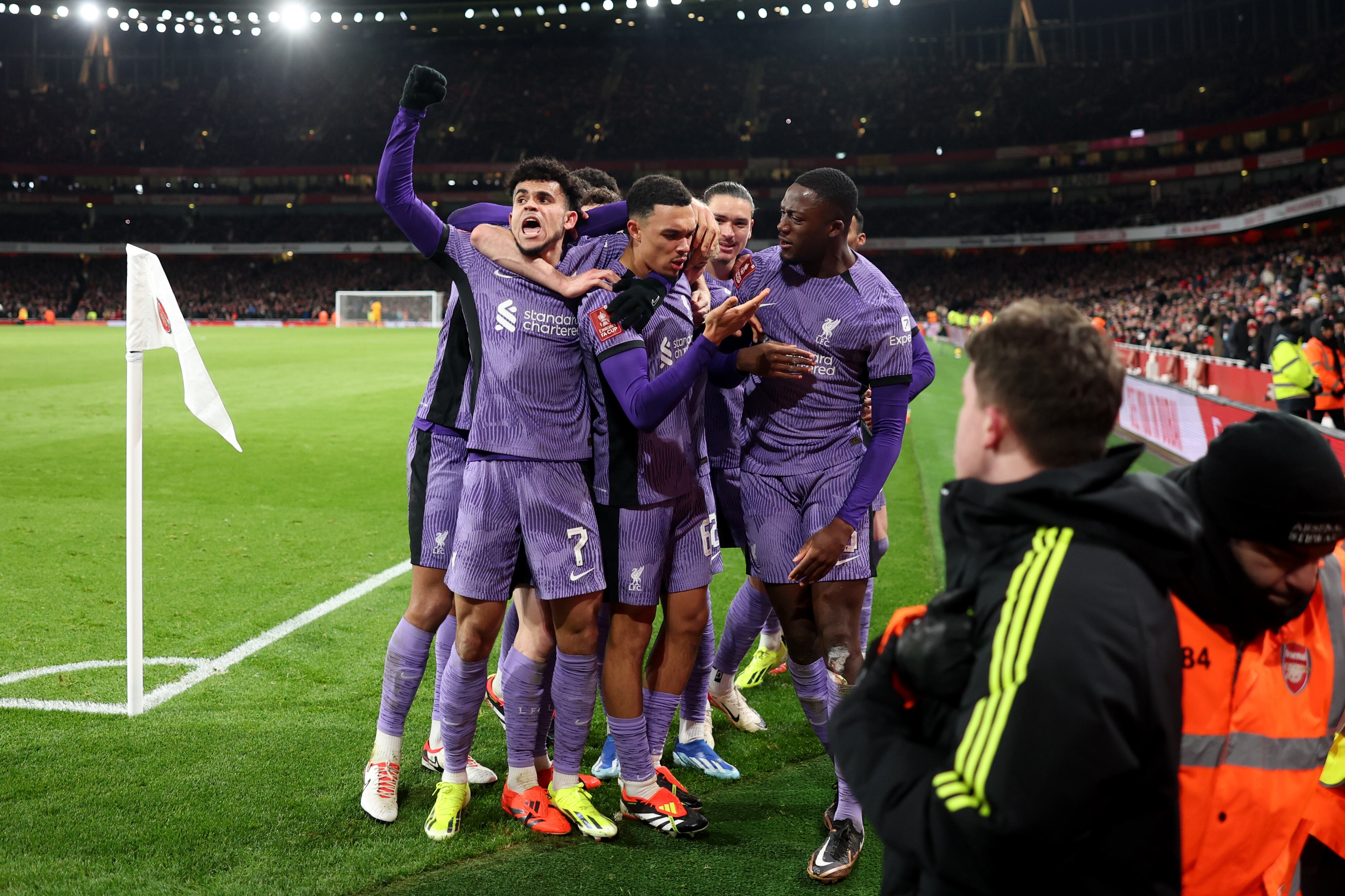 LONDON, ENGLAND - JANUARY 07: Luis Diaz and Trent Alexander-Arnold of Liverpool celebrate with teammates their team's first goal, an own goal scored by Jakub Kiwior of Arsenal (not pictured), during the Emirates FA Cup Third Round match between Arsenal and Liverpool at Emirates Stadium on January 07, 2024 in London, England. Arsenal wear an all-white kit at home, for the first time in the club's history, in support of the 'No More Red' campaign against knife crime and youth violence. (Photo by Julian Finney/Getty Images)
