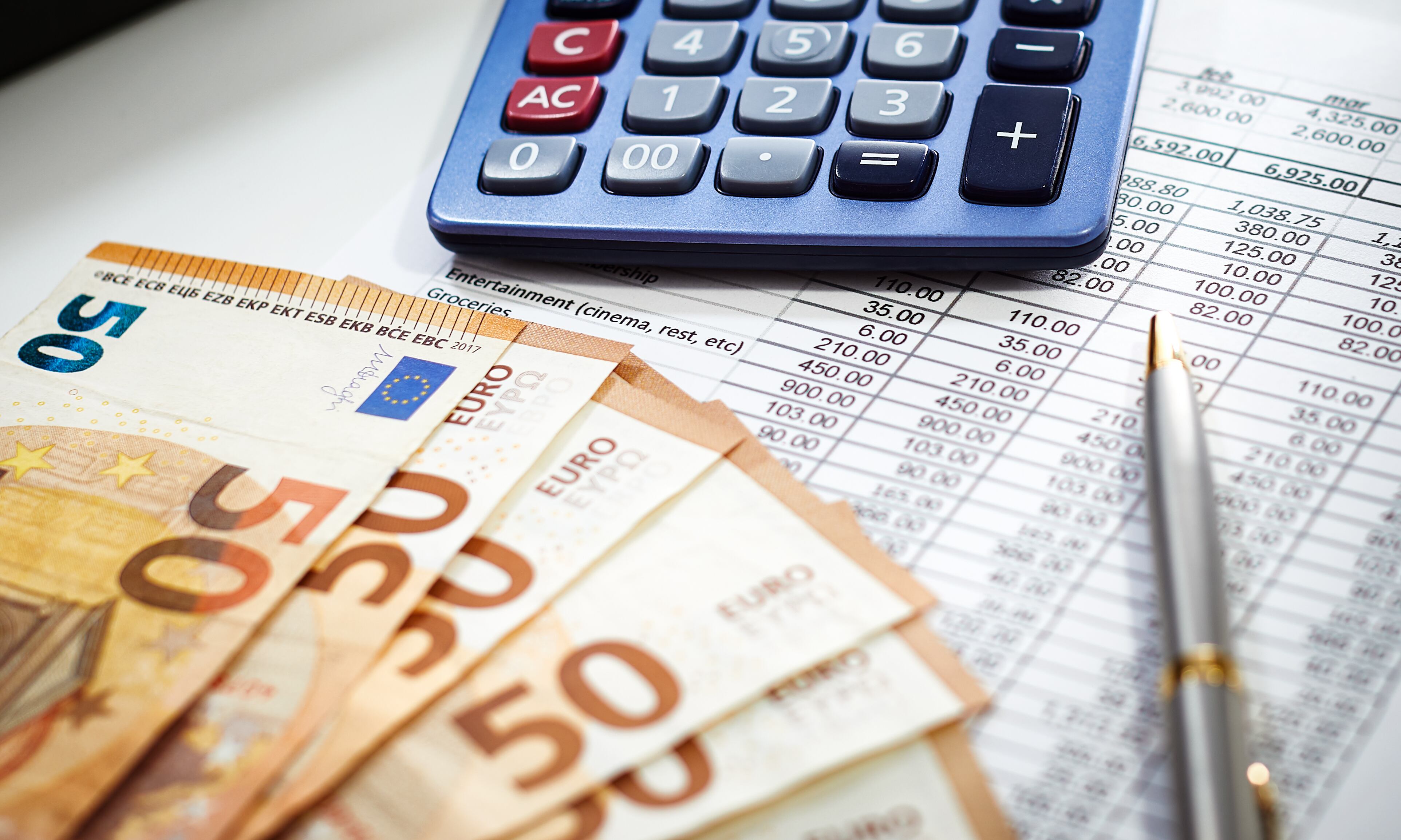 European Union currency with calculator, accounting concept, money, business, taxes, monthly expenses and personal finance, financial planner sheet