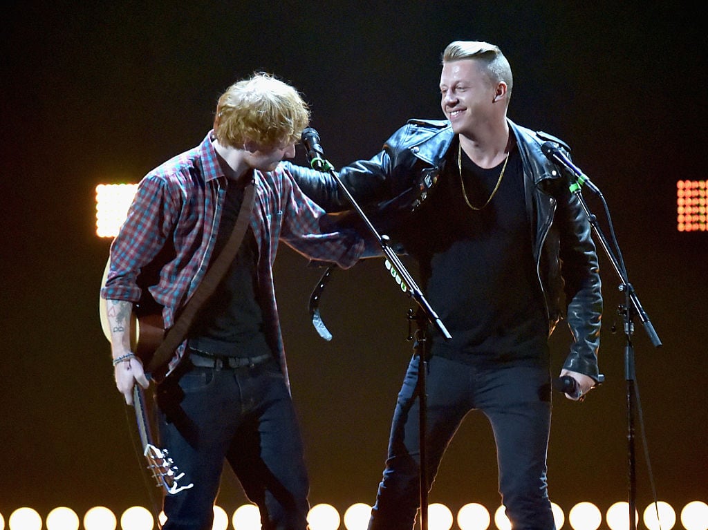 LAS VEGAS, NV - SEPTEMBER 20: Recording artists Ed Sheeran (L) and Macklemore perform ontage during the 2014 iHeartRadio Music Festival at the MGM Grand Garden Arena on September 20, 2014 in Las Vegas, Nevada. (Photo by Jeff Kravitz/FilmMagic)