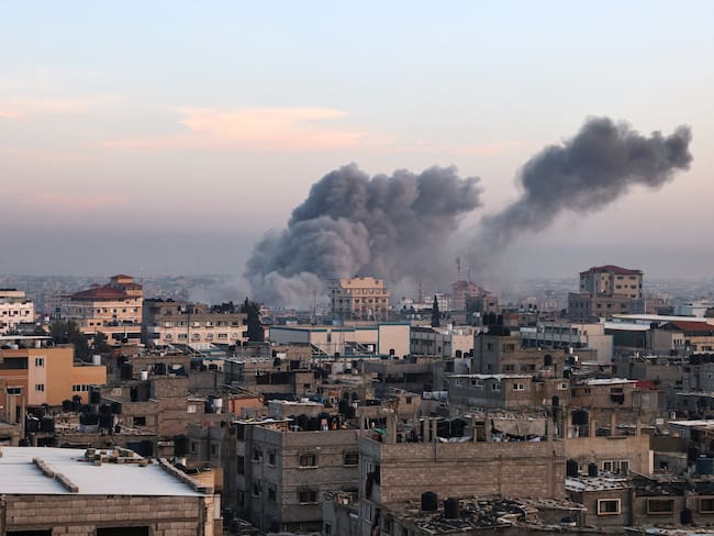 This picture taken in Rafah in the southern Gaza Strip shows smoke rising after an Israeli strike on December 3, 2023, amid continuing battles between Israel and the militant group Hamas. Israel carried out deadly bombardments in Gaza on December 3 as international calls mounted for greater protection of civilians and the renewal of an expired truce with Palestinian militant group Hamas. (Photo by SAID KHATIB / AFP) (Photo by SAID KHATIB/AFP via Getty Images)