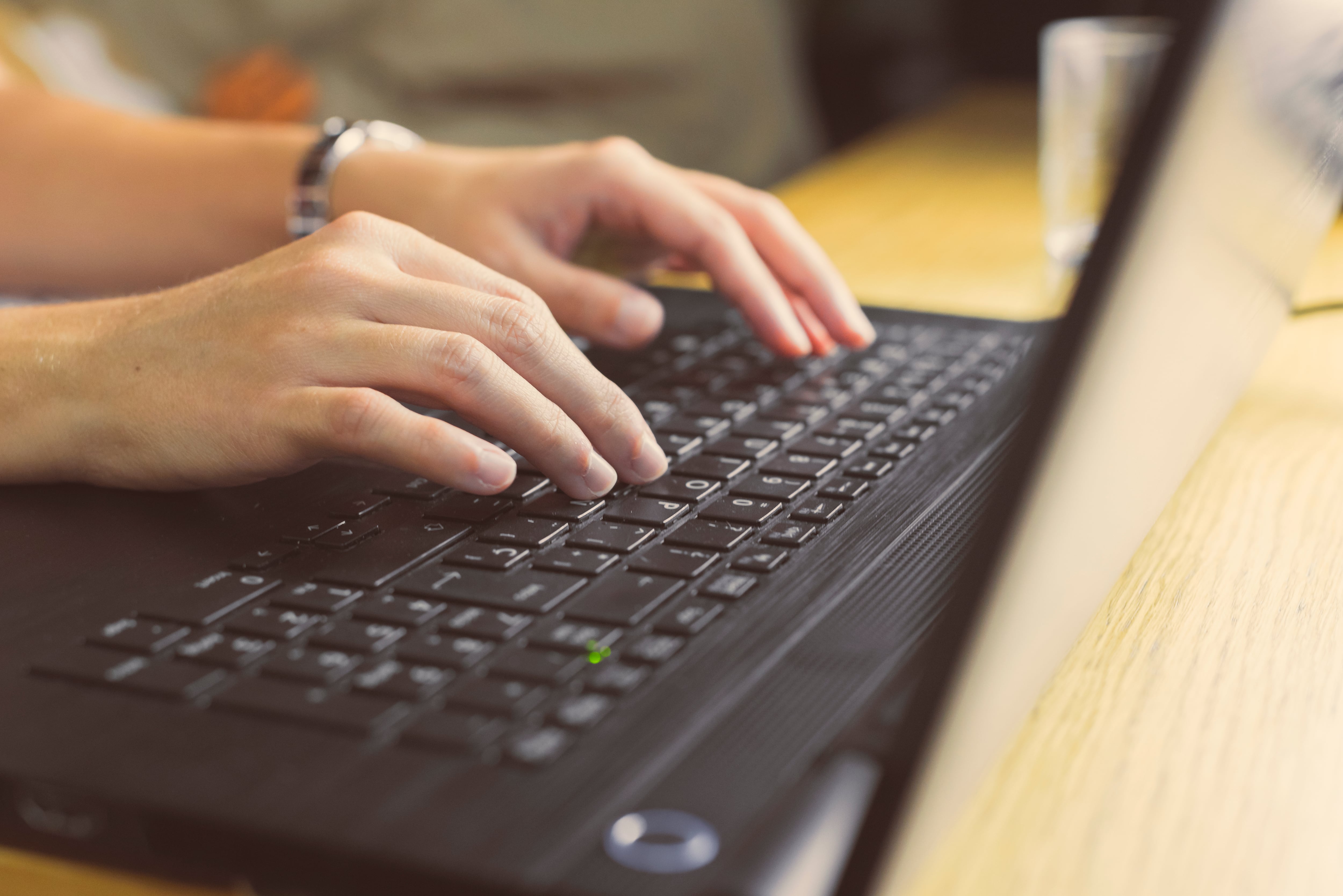 A young woman is entertaining with his laptop