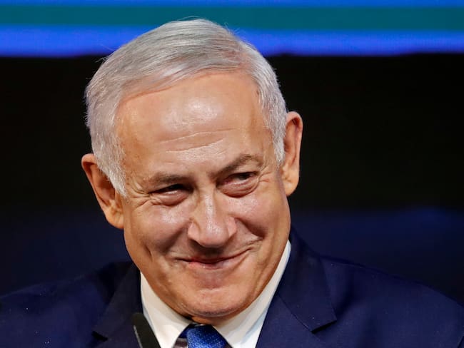 Israeli Prime Minister Benjamin Netanyahu smiles as he addresses supporters on election night at his Likud Party headquarters in the Israeli coastal city of Tel Aviv early on April 10, 2019. - The results from yesterday&#039;s vote came despite corruption allegations against the 69-year-old premier and put him on track to become Israel&#039;s longest-serving prime minister later this year. (Photo by THOMAS COEX / AFP) (Photo by THOMAS COEX/AFP via Getty Images)