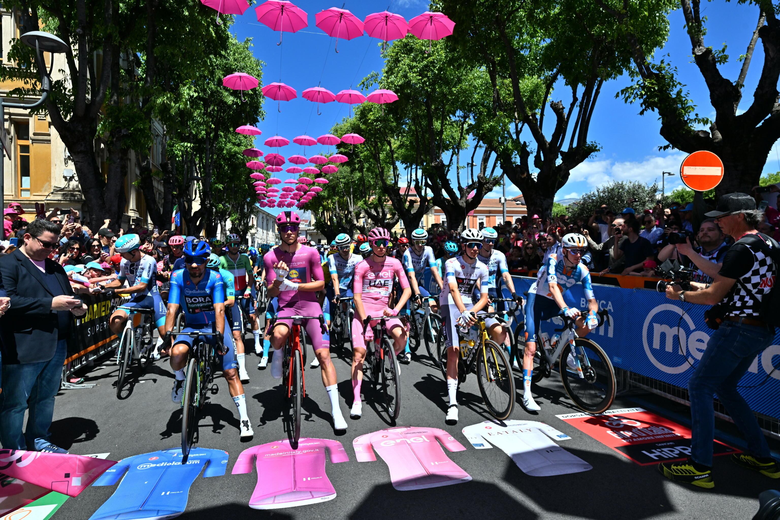 Avezzano (Italy), 12/05/2024.- (L-R) Colombian rider Daniel Felipe Martinez Poveda of Bora - Hansgrohe team wearing the best climber's blue jersey, italian rider Jonathan Milan of Lidl-Trek team wearing the points classification leader's, slovenian rider Tadej Pogacar of Uae Team Emirates wearing the overall leader's pink jersey, belgian rider Cian Uijtdebroeks of Visma Lease a Bike wearing the best young rider's white jersey, at the start of the 9th stage of the 107th 2024 Giro d'Italia cycling race over 214 km from Avezzano to Napoli, Italy, 12 May 2024. (Ciclismo, Italia, Eslovenia) EFE/EPA/LUCA ZENNARO