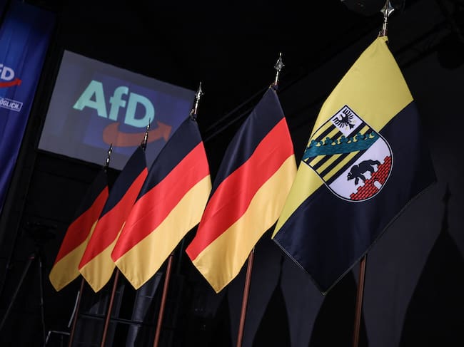 German Flags are lined up at the venue of the AfD's election party during Saxony-Anhalt's state elections in Magdeburg, eastern Germany on September 6, 2026. (Photo by Ronny HARTMANN / AFP)