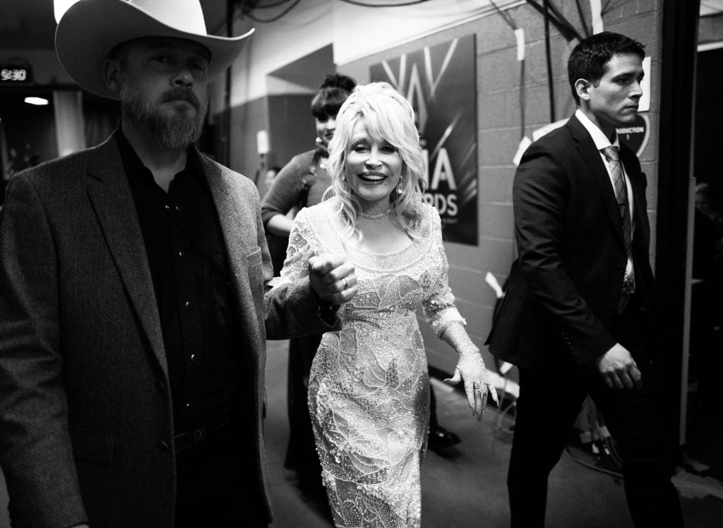 NASHVILLE, TENNESSEE - NOVEMBER 13: (FOR EDITORIAL USE ONLY) (EDITORS NOTE: Image has been converted to black and white.) Dolly Parton backstage at the 53rd annual CMA Awards at Bridgestone Arena on November 13, 2019 in Nashville, Tennessee. (Photo by Robby Klein/Getty Images for CMA)