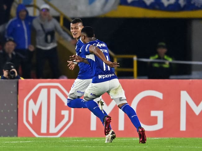 Millonarios&#039; forward Luis Paredes (back) celebrates with midfielder Beckham Castro after scoring a goal during the Copa Sudamericana group stage second leg football match between Colombia&#039;s Millonarios and Uruguay&#039;s Peñarol at the Nemesio Camacho &quot;El Campín&quot; stadium in Bogota, on May 23, 2023. (Photo by Juan BARRETO / AFP) (Photo by JUAN BARRETO/AFP via Getty Images)