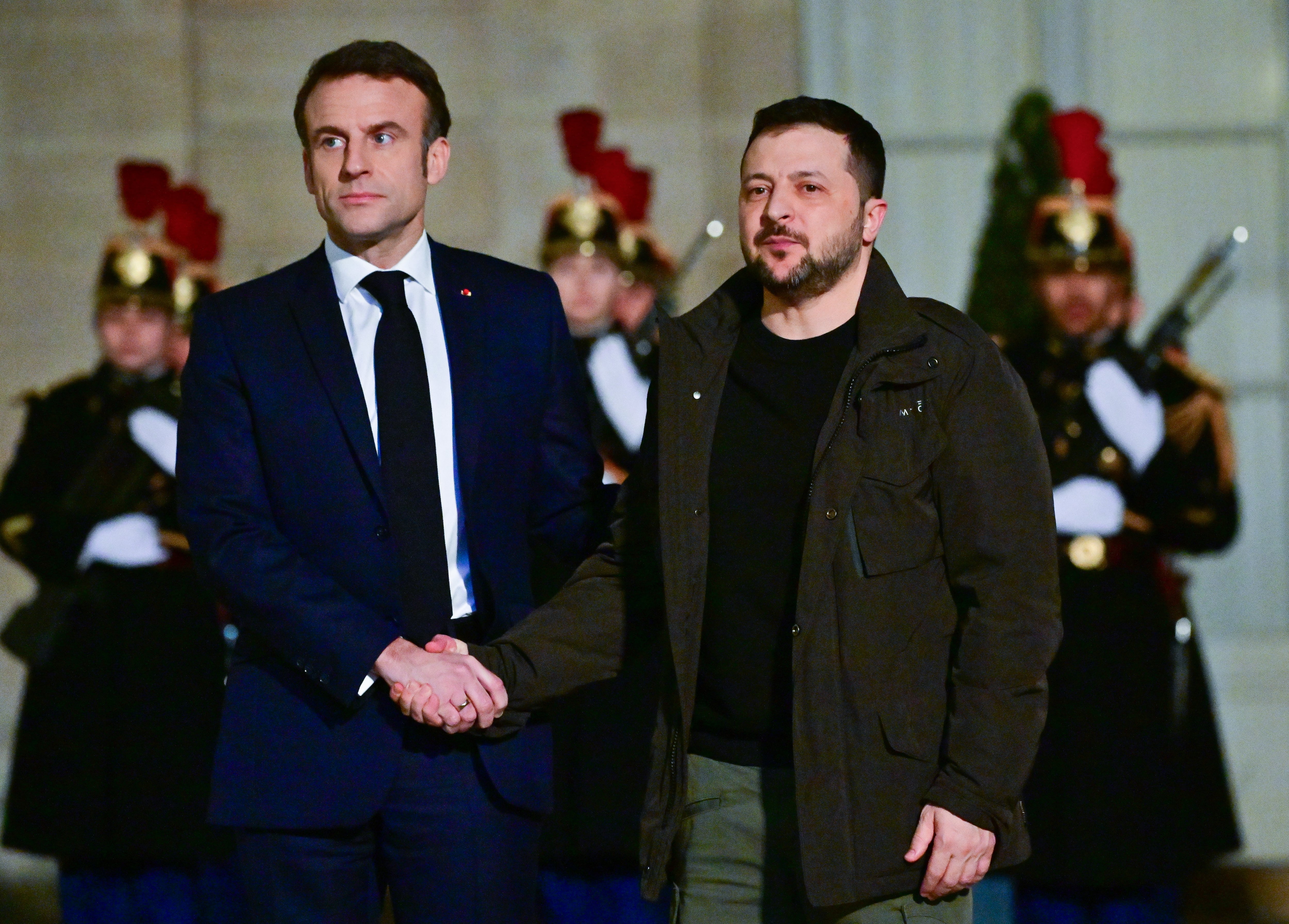 PARIS, FRANCE - FEBRUARY 16: French President Emmanuel Macron welcomes Ukrainian President Volodomyr Zelensky prior to a meeting at the Elysee Presidential Palace on February 16, 2024 in Paris, France. The two heads of state are set to sign a bilateral security agreement, following commitments made in G7 format on the sidelines of the NATO summit in Vilnius in 2023 Photo by Christian Liewig - Corbis/Getty Images)