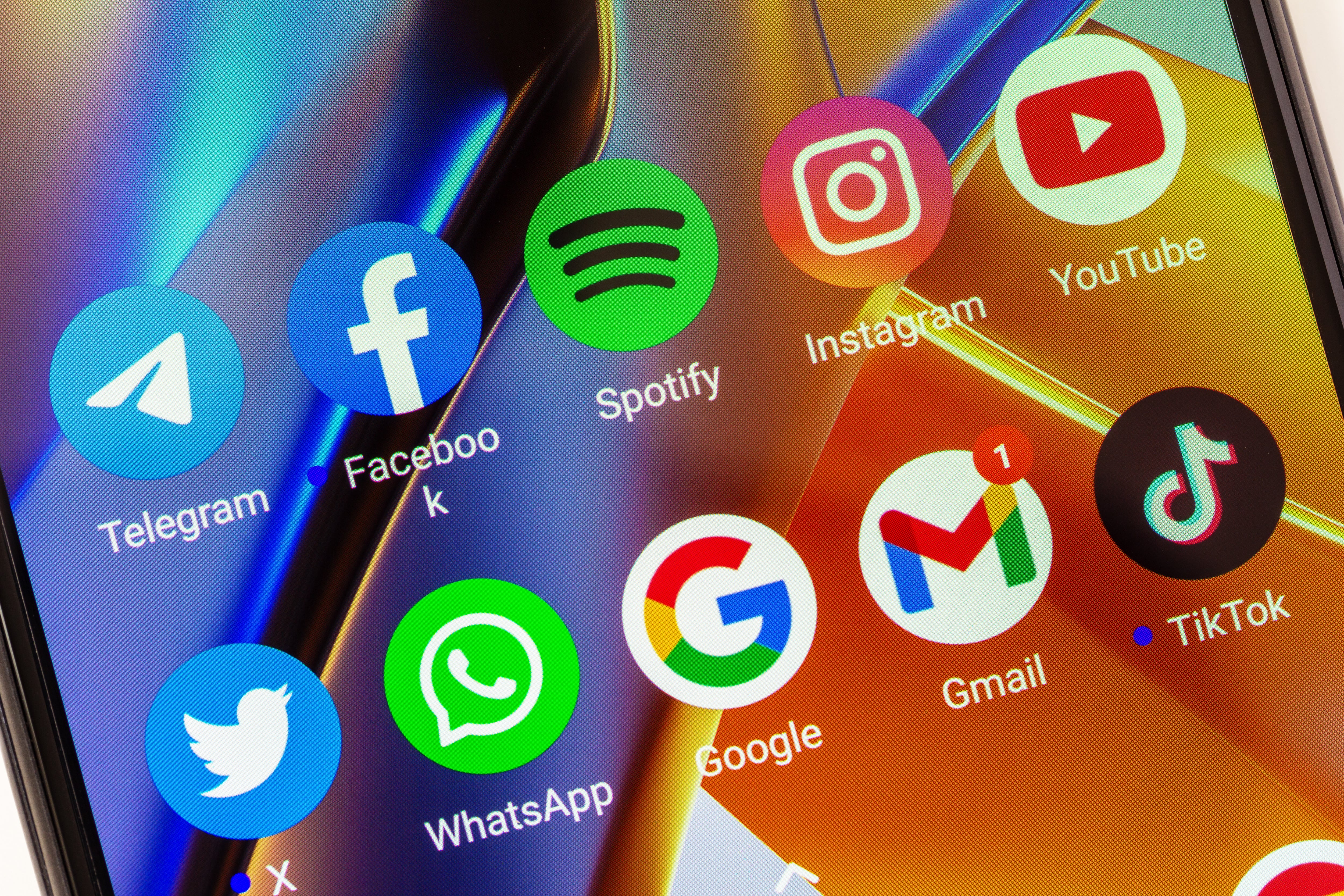 Adygea, Russia - August 11, 2023: telegram, facebook, spotify, instagram, youtube, twitter, whatsapp, google, gmail, tik tok mobile app icons on xiaomi poco smartphone screen closeup - gutaper