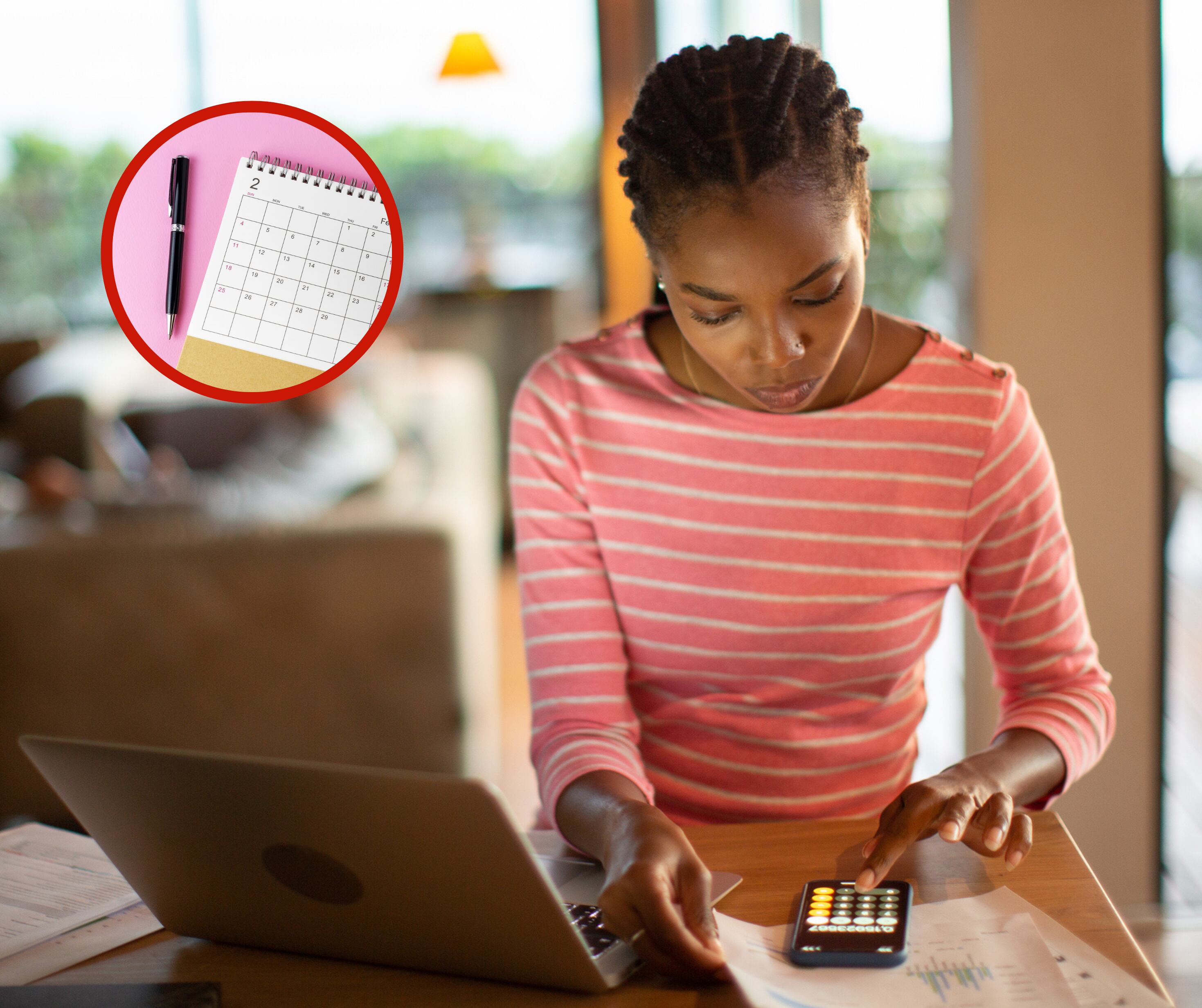 Mujer haciendo cálculos en un celular junto a un computador y calendario (Fotos vía Getty Images)