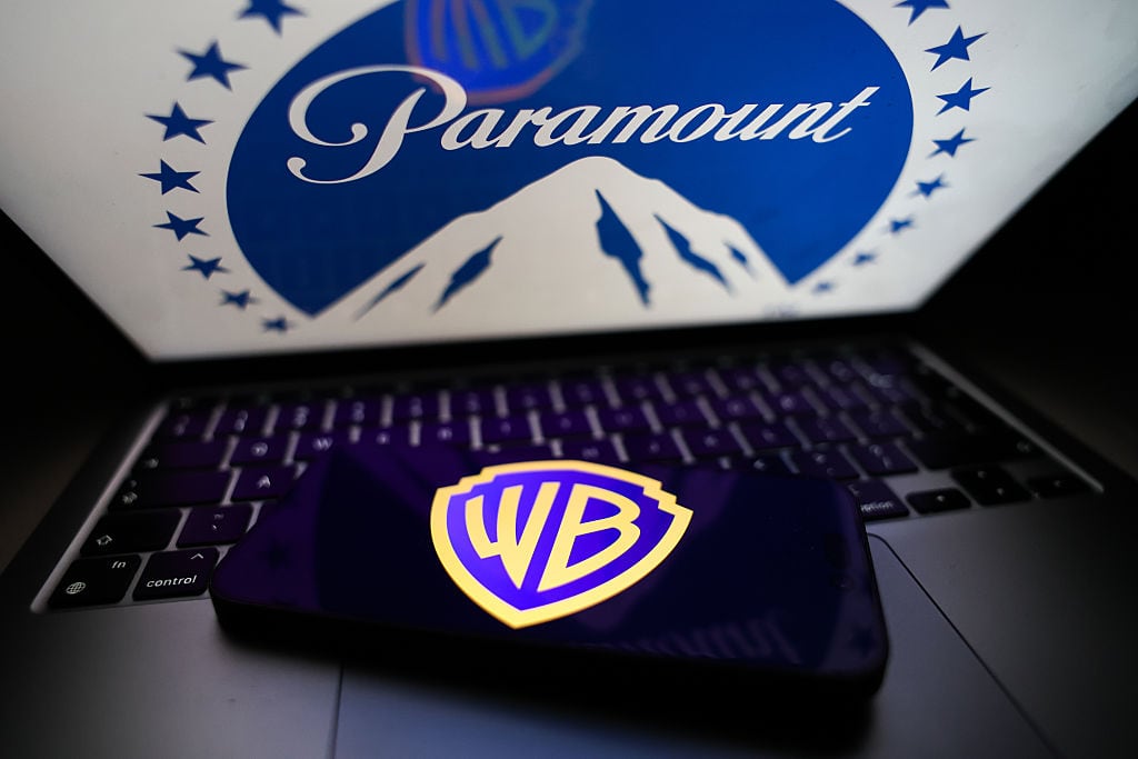 Paramount logo displayed on a laptop screen and Warner Bros logo displayed on a phone screen are seen in this illustration photo taken in Krakow, Poland on February 28, 2026. (Photo by Jakub Porzycki/NurPhoto via Getty Images)