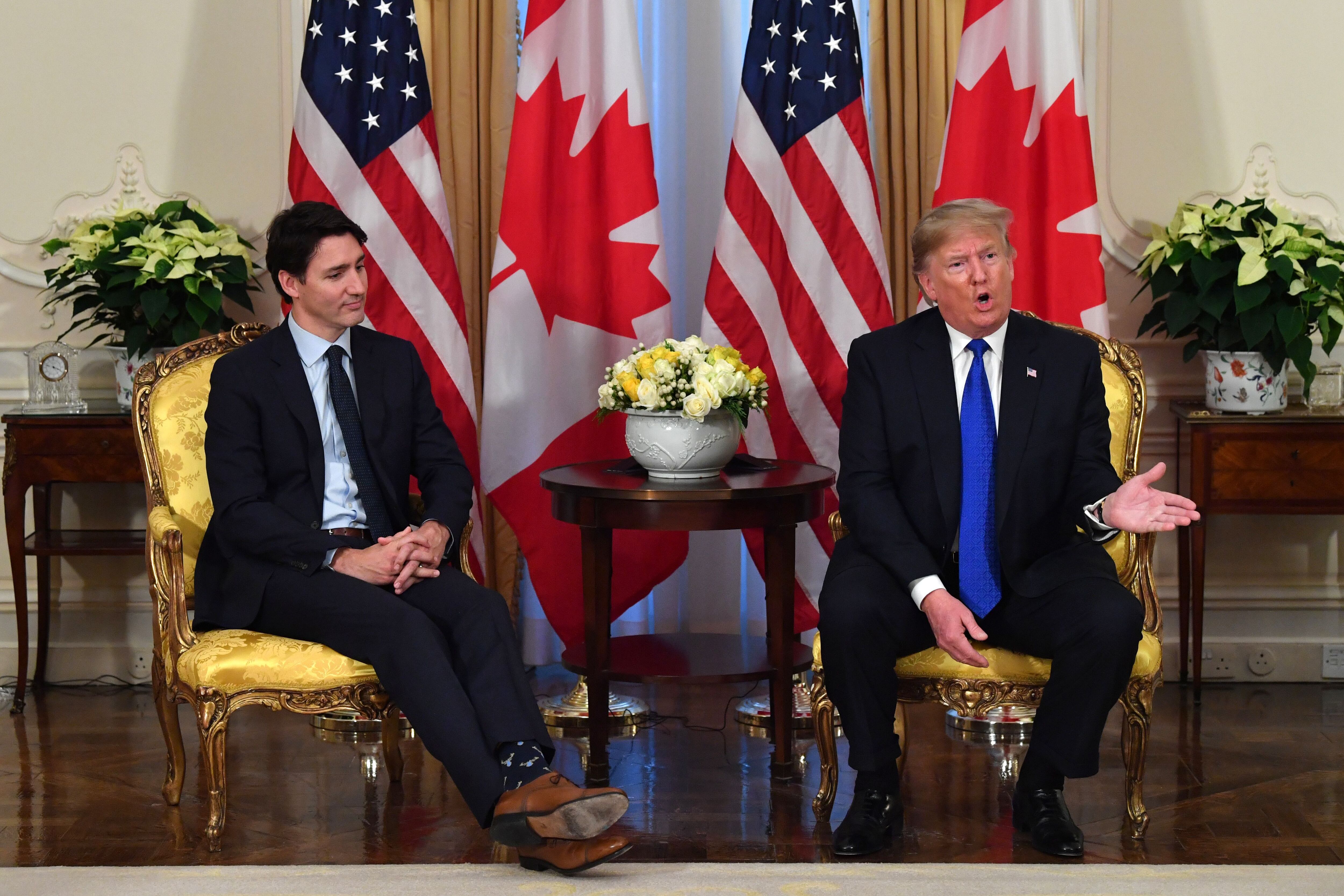 US President Donald Trump (R) speaks during a meeting with Canada's Prime Minister Justin Trudeau at Winfield House, London on December 3, 2019. -