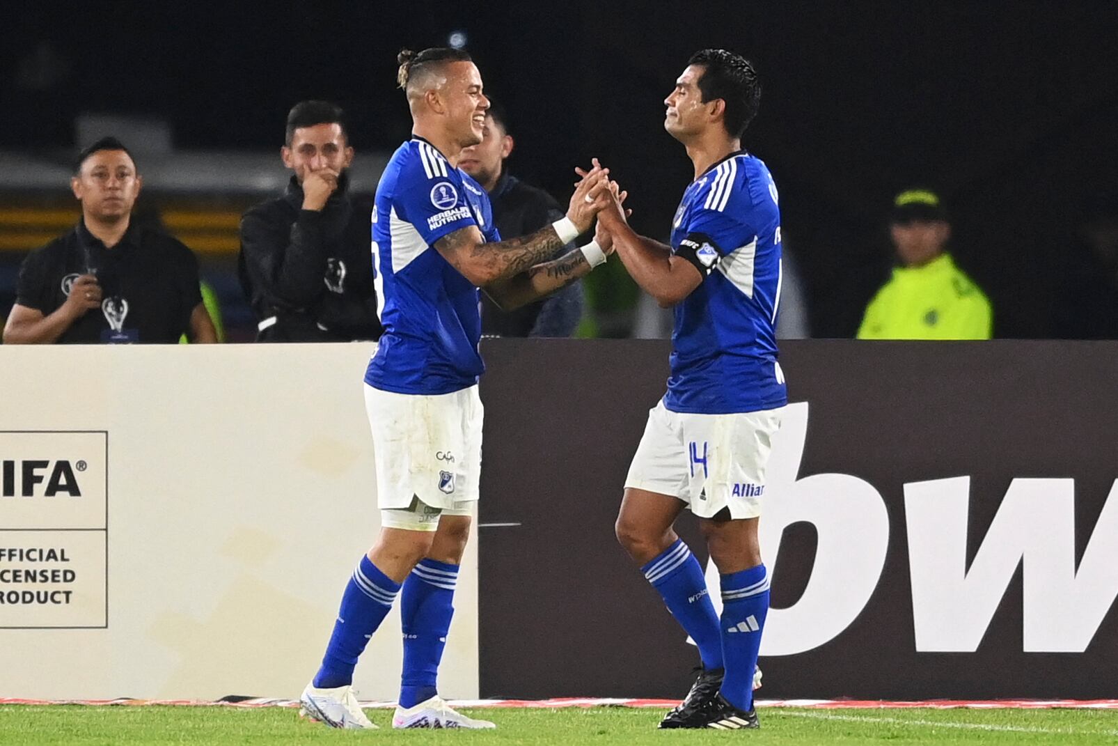 Millonarios' forward Leonardo Castro (L) celebrates after scoring during the Copa Sudamericana group stage first leg football match between Millonarios and Defensa y Justicia, at the El Campin stadium in Bogota on April 4, 2023. (Photo by Juan BARRETO / AFP) (Photo by JUAN BARRETO/AFP via Getty Images)