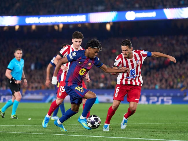 BARCELONA, SPAIN - APRIL 08: Lamine Yamal of FC Barcelona is challenged by Julian Alvarez and Jorge Resurreccion 'Koke' of Atletico de Madrid during the UEFA Champions League 2025/26 Quarter-Final First Leg match between FC Barcelona and Club Atlético de Madrid at Camp Nou on April 08, 2026 in Barcelona, Spain. (Photo by Alex Caparros - UEFA/UEFA via Getty Images)