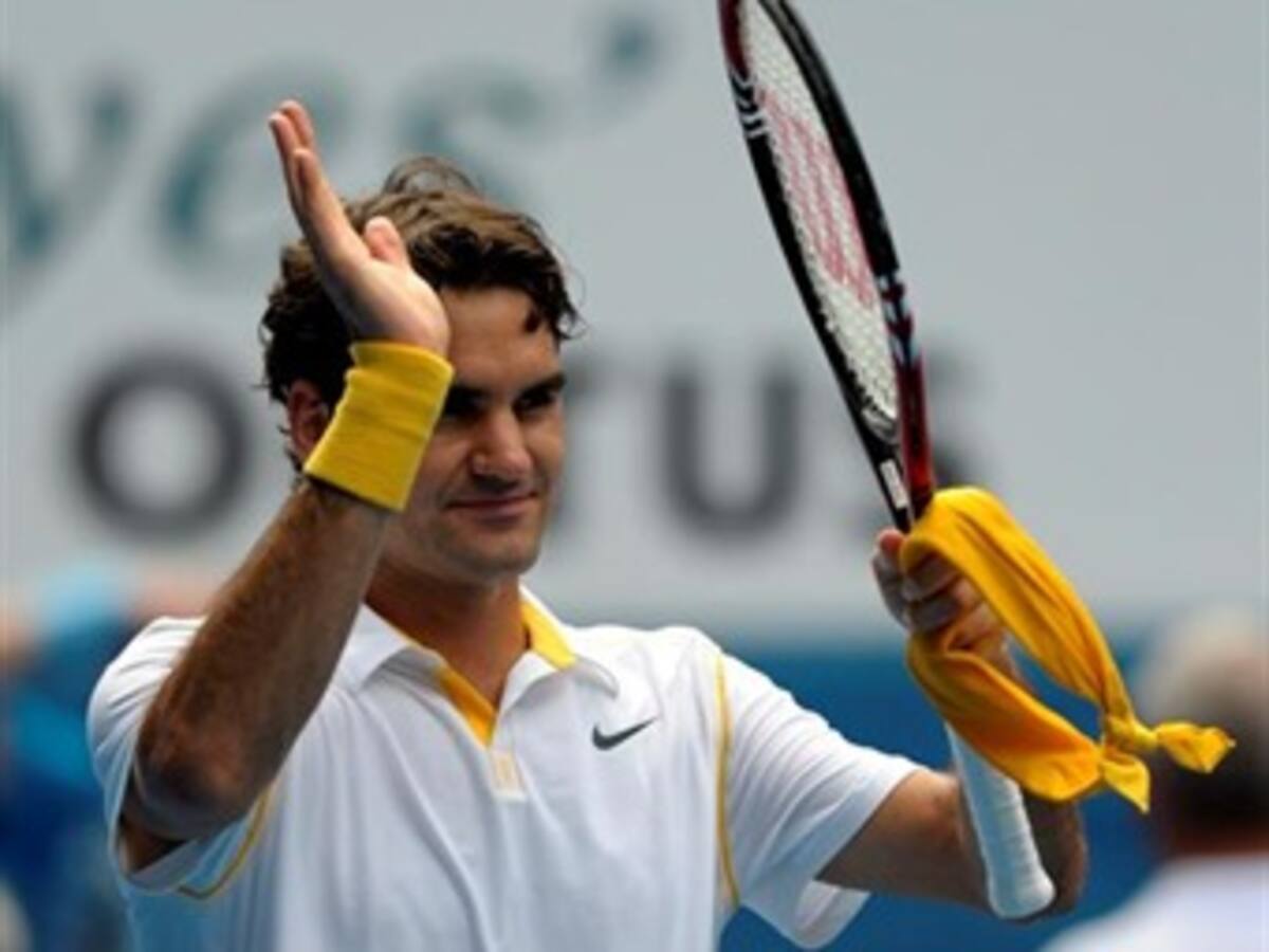 Roger Federer y Caroline Woznkiacki avanzaron a segunda ronda de Australia