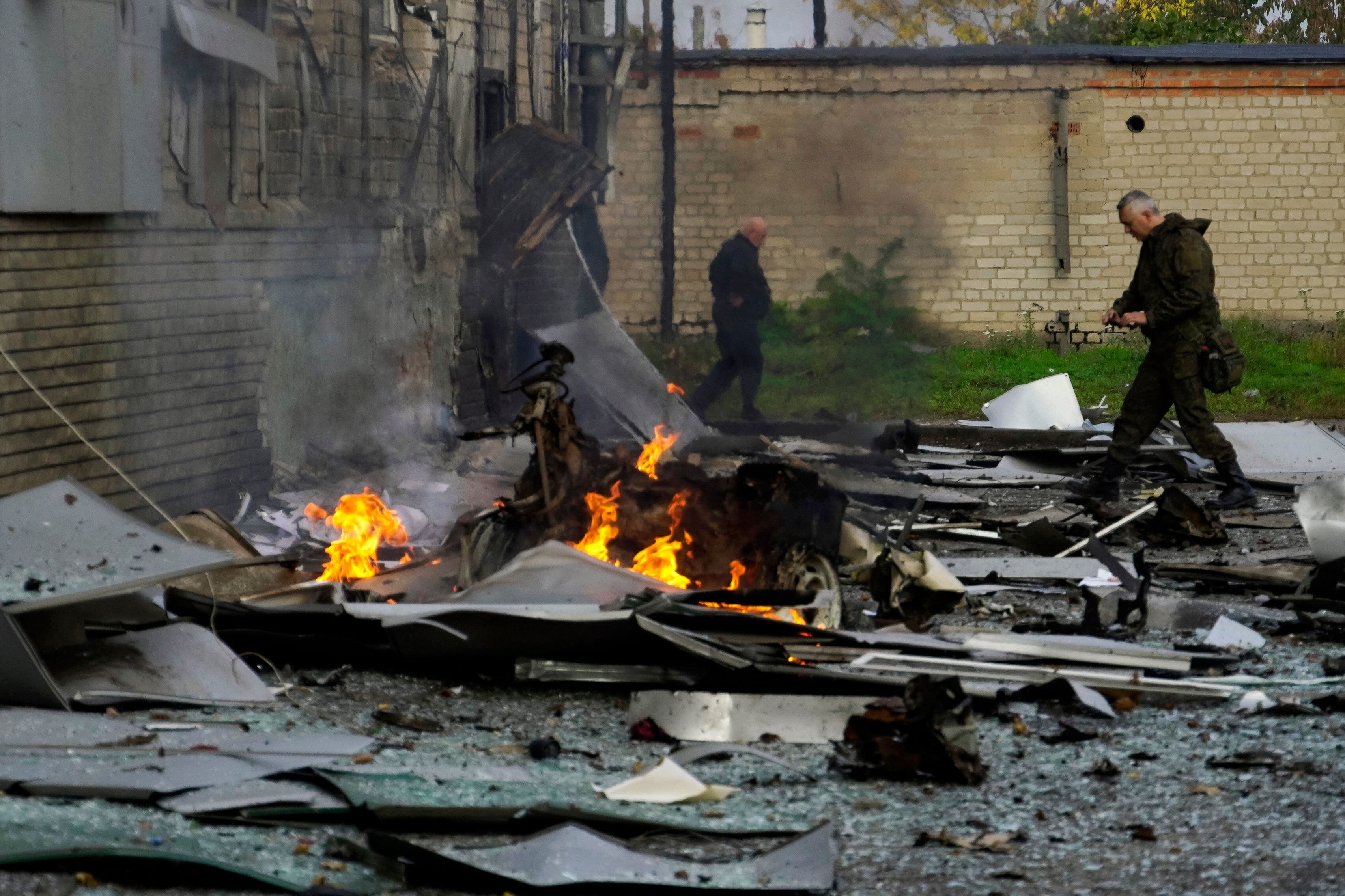 A view shows the site of a car bomb explosion outside a building housing a local TV station in the Russian-held city of Melitopol in southern Ukraine on October 25, 2022. (Photo by STRINGER / AFP) (Photo by STRINGER/AFP via Getty Images)