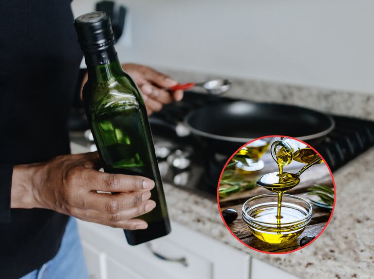 Persona cocinando con aceite de oliva extra virgen (Getty Images)