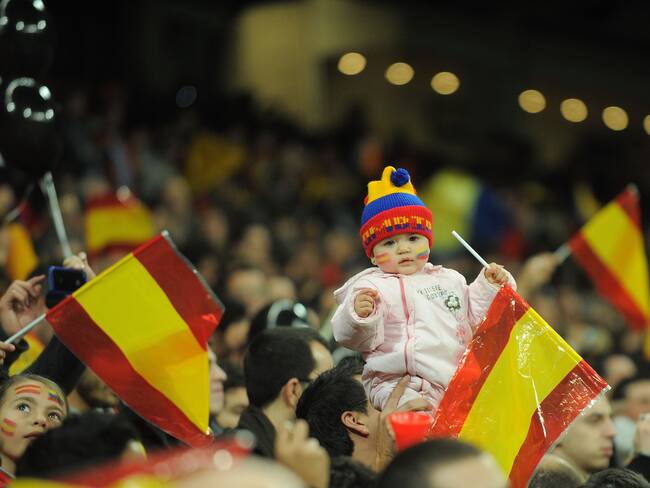 MADRID, SPAIN - FEBRUARY 09:  A baby wears a hat with the Colombian colours while holding a Spanish flag during the International friendly match between Spain and Colombia at Estadio Santiago Bernabeu on February 9, 2011 in Madrid, Spain.  (Photo by Denis Doyle/Getty Images)