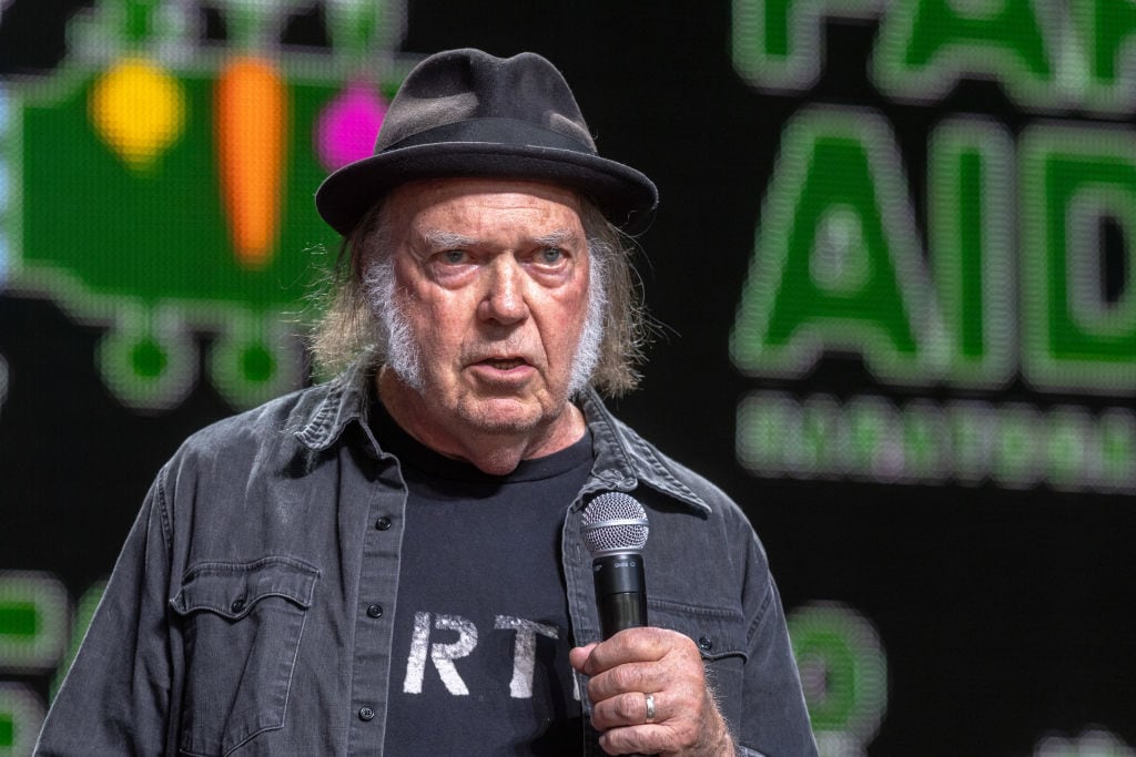 SARATOGA SPRINGS, NEW YORK - SEPTEMBER 21: Neil Young on stage during Farm Aid 2024 at Saratoga Performing Arts Center on September 21, 2024 in Saratoga Springs, New York. (Photo by Gary Miller/Getty Images)