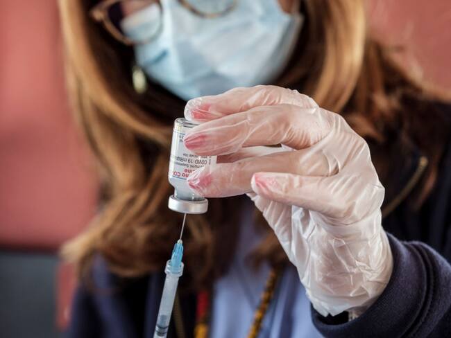 A member of the Italian medical staff prepares doses of the modern pharmaceutical company's Covid-19 vaccine for administration via drive-in for citizens over 80, at the Ferrari Orsi military barracks in Caserta, southern Italy, on March 25, 2020. (Photo by Manuel Dorati/NurPhoto via Getty Images)