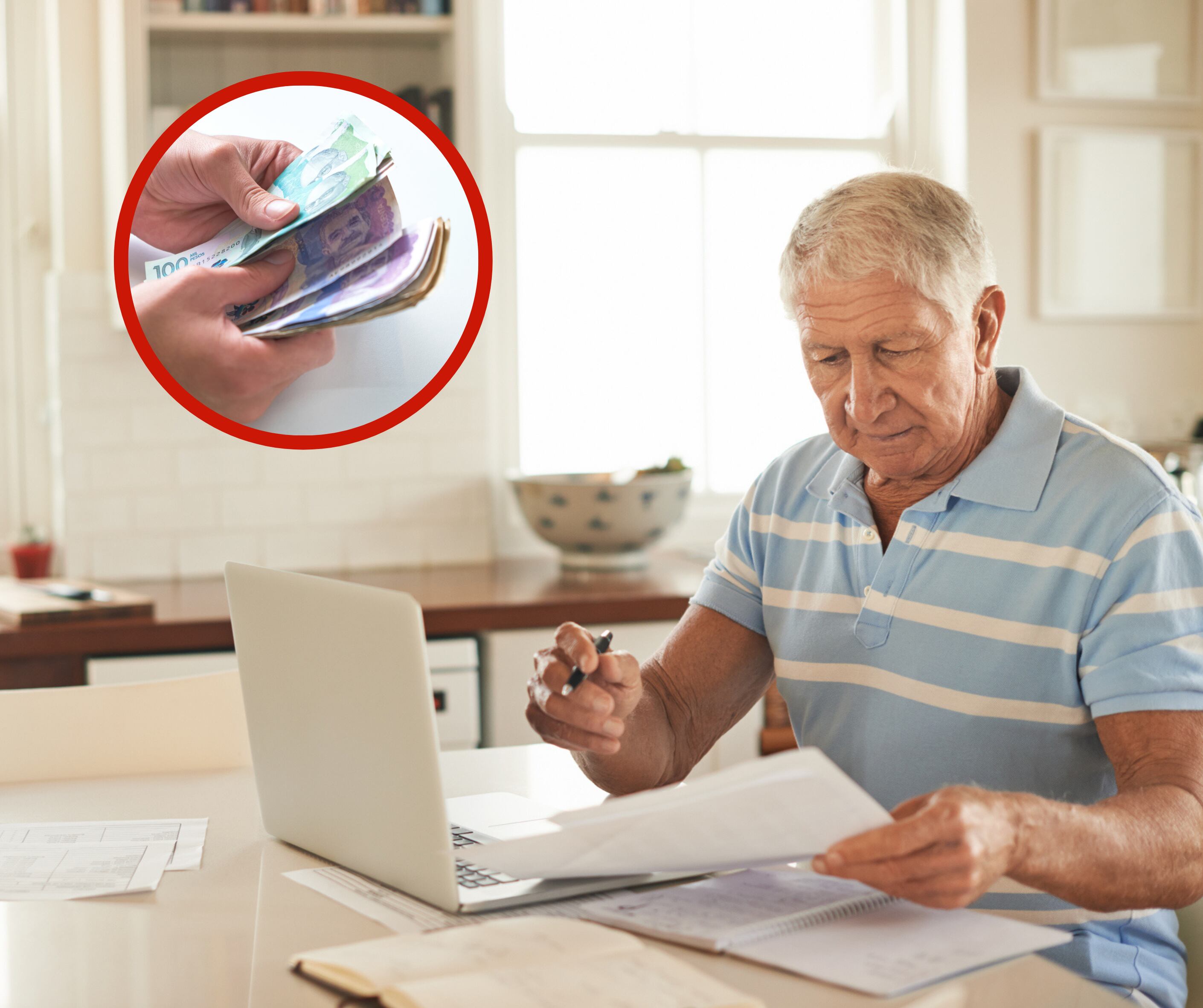Hombre con una computadora y papeles sobre una mesa junto a unos billetes (Foto vía Getty Images)