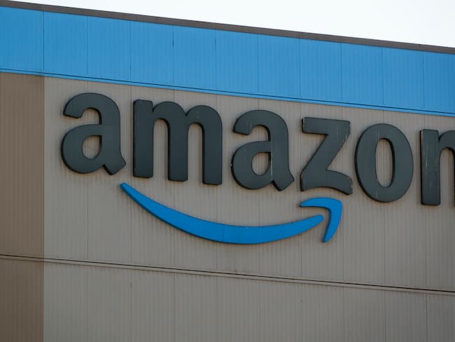 SAN DIEGO, CALIFORNIA - OCTOBER 4: An Amazon logo is displayed outside an Amazon Sortation Center on October 4, 2025 in San Diego, California. (Photo by Kevin Carter/Getty Images)