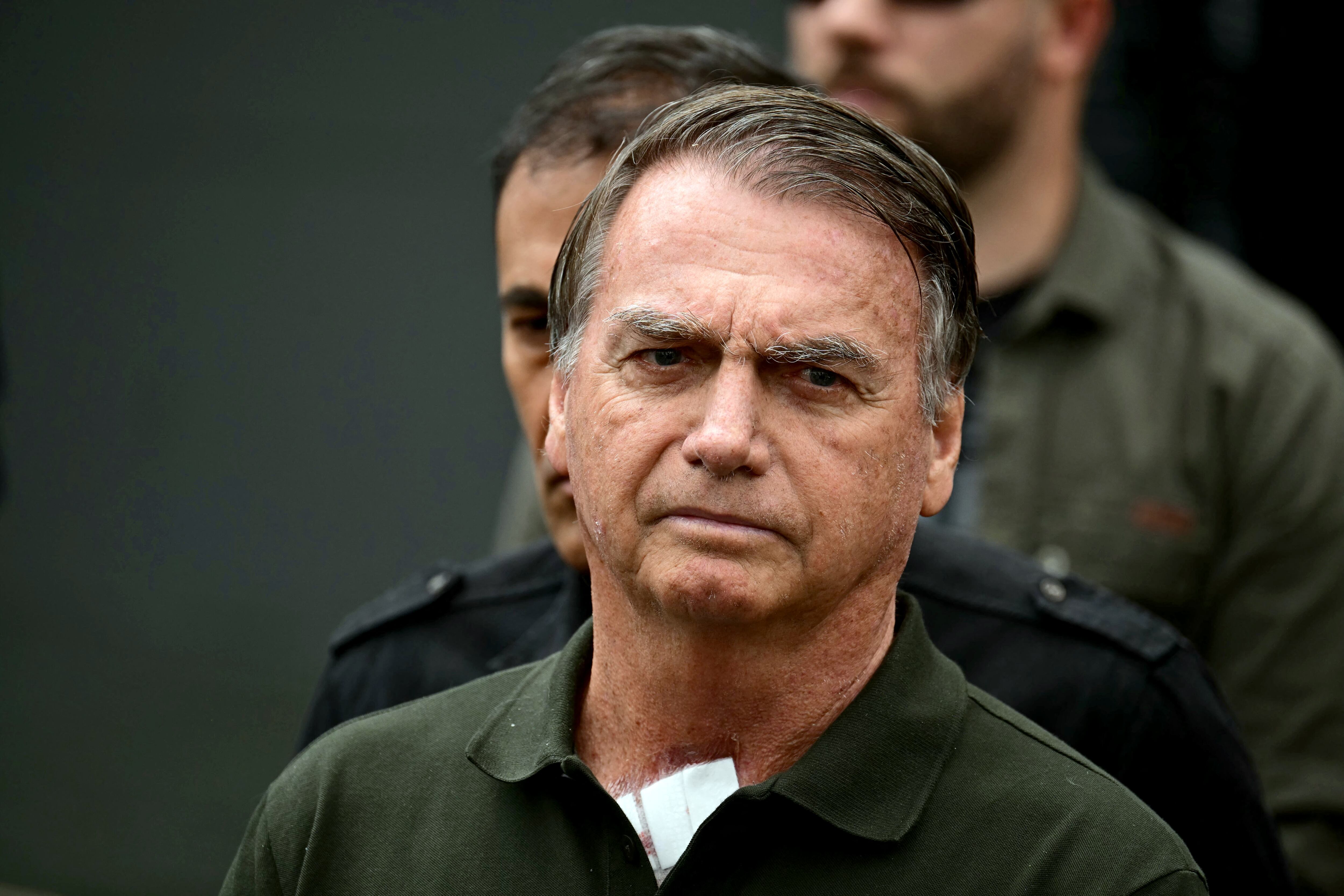 (FILES) Former Brazilian President (2019-2022) Jair Bolsonaro leaves the DF Star hospital in Brasilia on September 14, 2025, after undergoing a series of medical examinations, as he remains under house arrest. Former Brazilian president Jair Bolsonaro's lawyers on October 27, 2025, filed an appeal against his 27-year prison sentence for a botched coup bid after his 2022 election loss. (Photo by Pablo PORCIUNCULA / AFP)