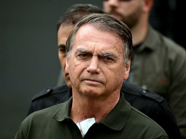 (FILES) Former Brazilian President (2019-2022) Jair Bolsonaro leaves the DF Star hospital in Brasilia on September 14, 2025, after undergoing a series of medical examinations, as he remains under house arrest. Former Brazilian president Jair Bolsonaro's lawyers on October 27, 2025, filed an appeal against his 27-year prison sentence for a botched coup bid after his 2022 election loss. (Photo by Pablo PORCIUNCULA / AFP)