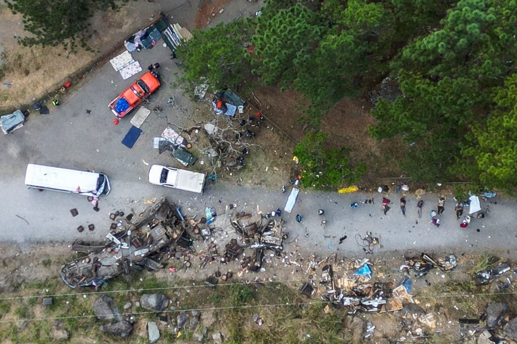 EDITORS NOTE: Graphic content / Aerial view of the aftermath after a bus transporting migrant people crashed in Gualaca, Panama on February 15, 2023. - At least 39 people, most of them undocumented US-bound migrants who had just survived a perilous jungle crossing, died in a bus crash in Panama early Wednesday, officials said. (Photo by Mauricio VALENZUELA / AFP) (Photo by MAURICIO VALENZUELA/AFP via Getty Images)