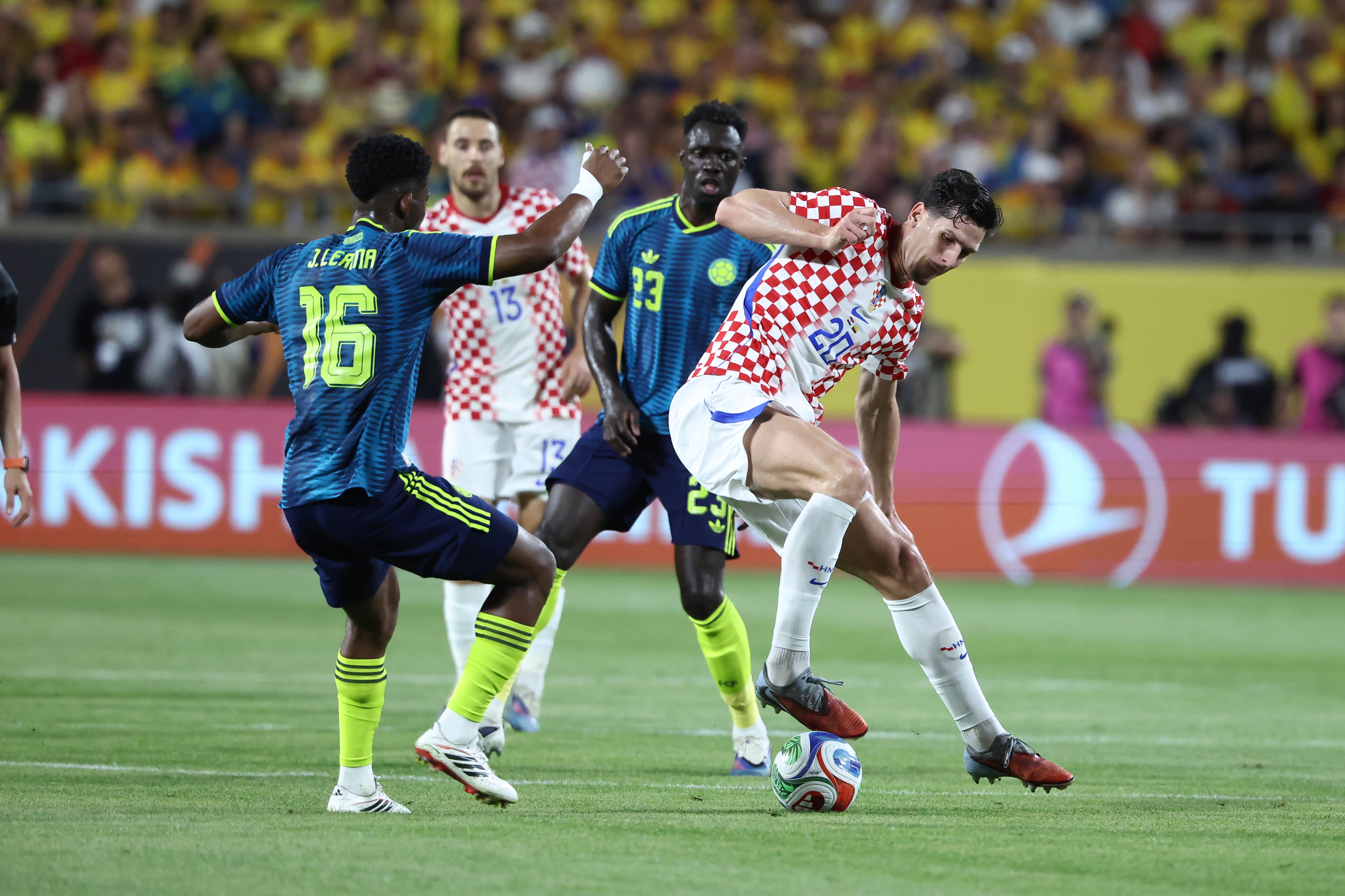ORLANDO, FL - MARCH 26: Croatia's I. Matanovic (20) does a nifty move to juke Colombia midfielder Jefferson Lerma (16) in the first half during the Road to 26 match between Colombia and Croatia on Thursday, March 26, 2026 at Camping World Stadium in Orlando, FL (Photo by Peter Joneleit/Icon Sportswire via Getty Images)