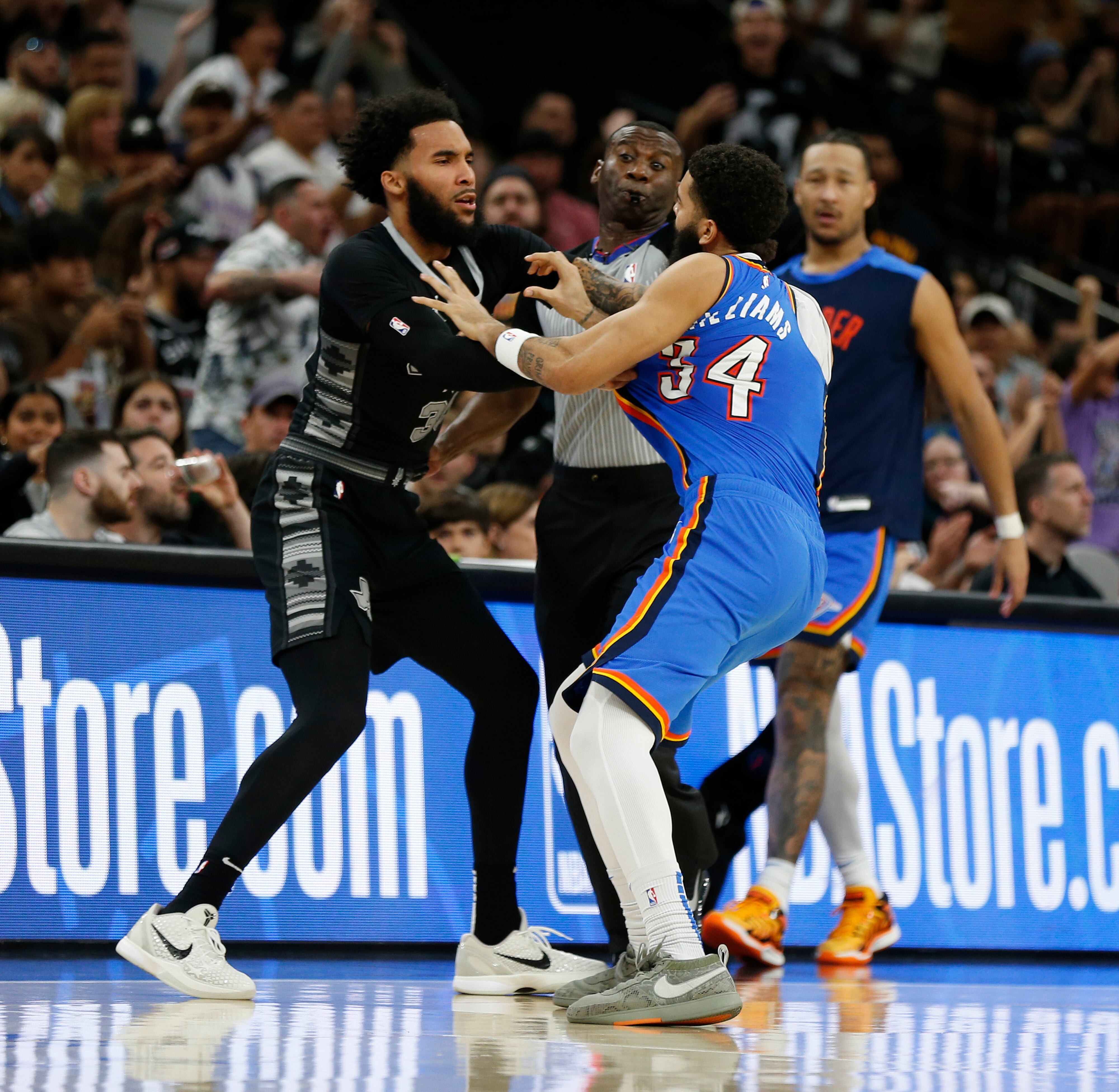 Julian Champagnie con Kenrich Williams/Getty Images.
