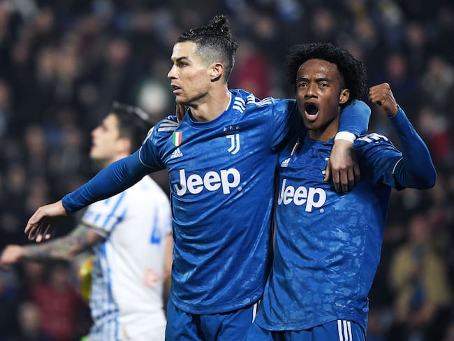 Juan Guillermo Cuadrado y Cristiano Ronaldo ya compartieron equipo en la Juventus durante tres temporadas. (Photo by Isabella BONOTTO / AFP) (Photo by ISABELLA BONOTTO/AFP via Getty Images)