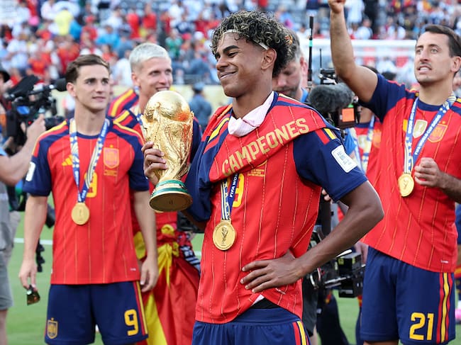 EAST RUTHERFORD, NEW JERSEY - JULY 19: Lamine Yamal #19 of Spain holds the trophy following the FIFA World Cup 2026 Final football match between Spain and Argentina at New York New Jersey Stadium on July 19, 2026 in East Rutherford, New Jersey. (Photo by Jean Catuffe/Getty Images)