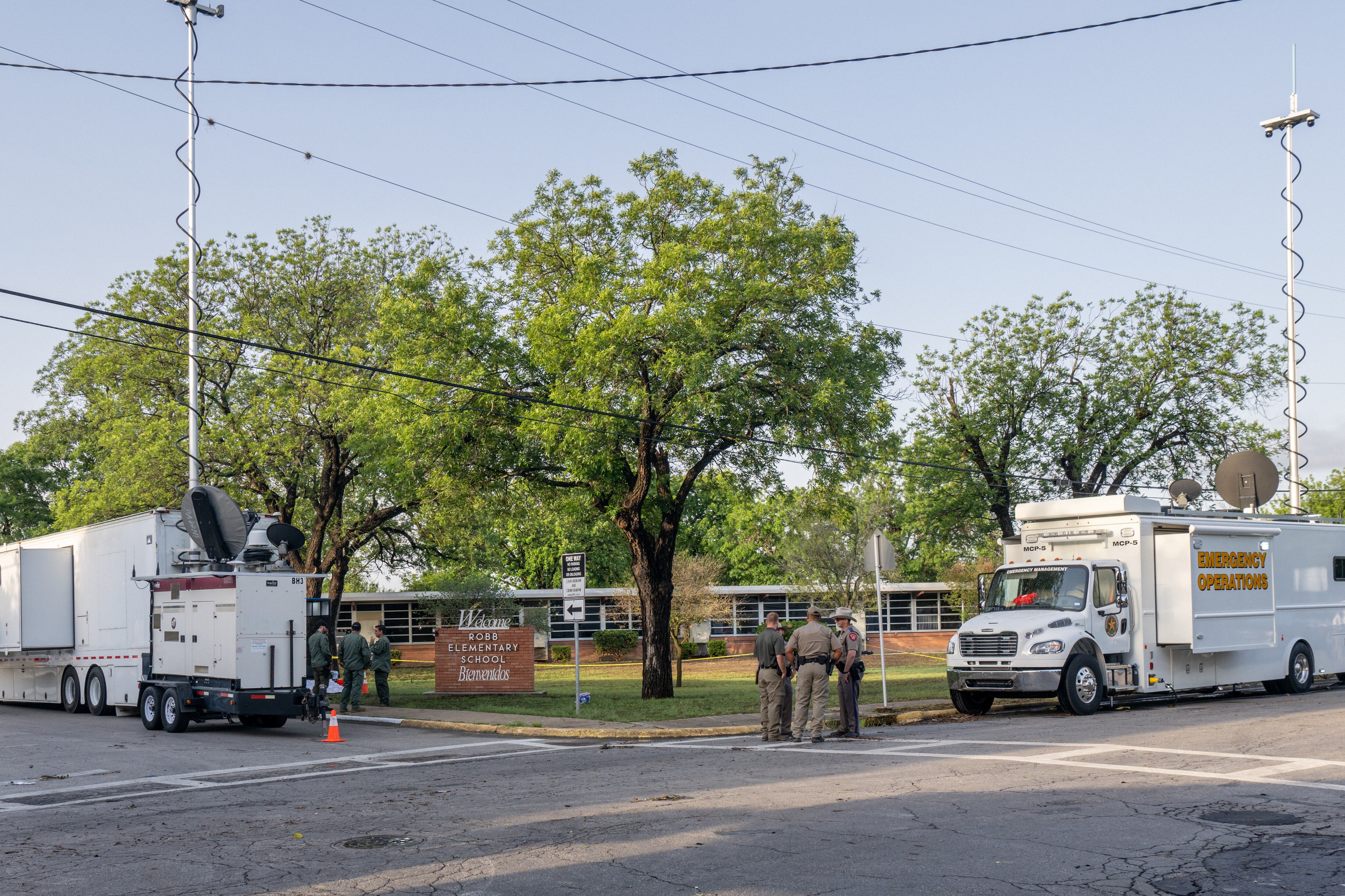 UVALDE, TEXAS - MAY 25: Law enforcement officers gather outside of Robb Elementary School following the mass shooting at Robb Elementary School on May 25, 2022 in Uvalde, Texas. According to reports, 19 students and 2 adults were killed, with the gunman fatally shot by law enforcement. (Photo by Brandon Bell/Getty Images)