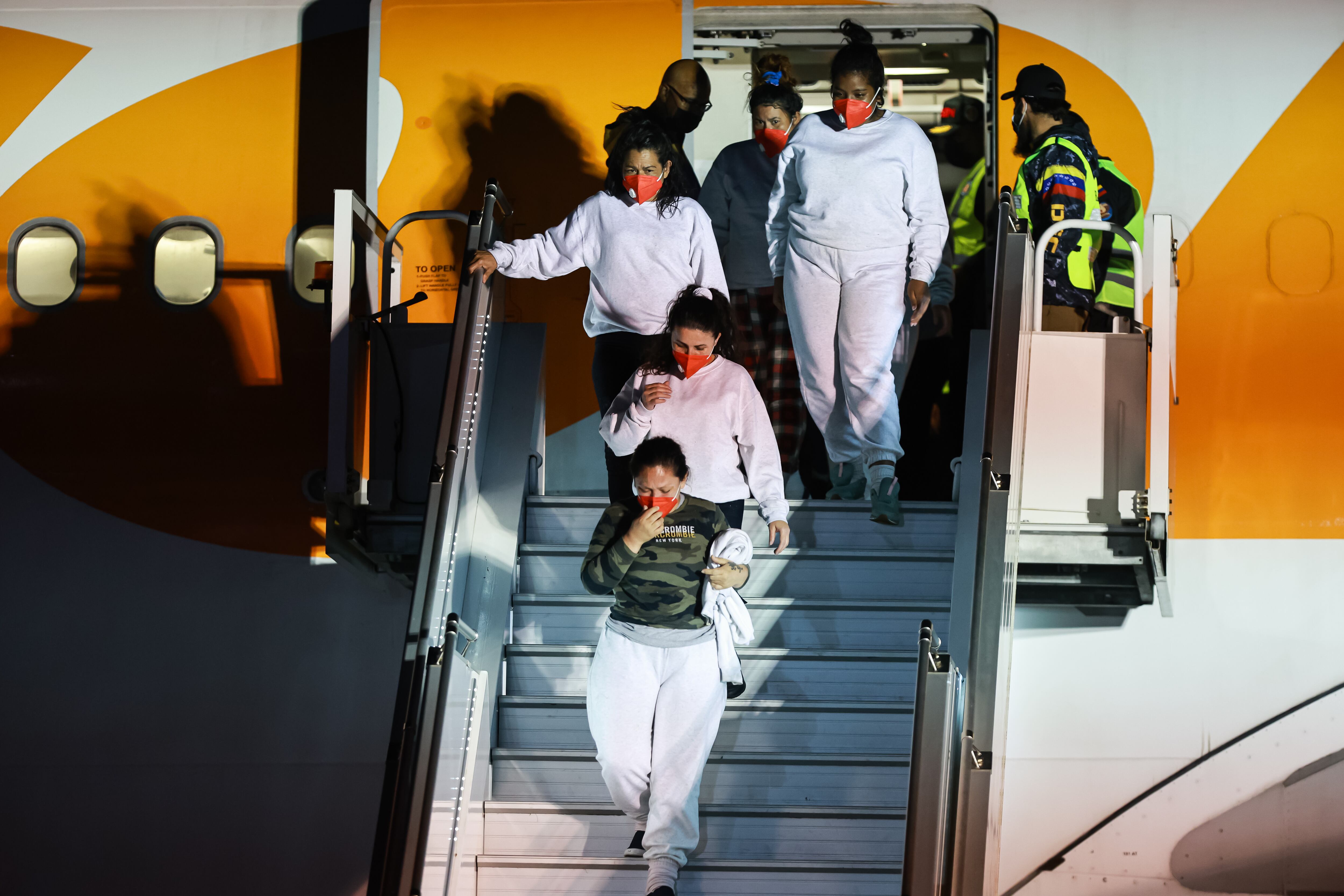 28 March 2025, Venezuela, Maiquetia: Venezuelans deported from the USA arrive at Simon Bolivar International Airport on a repatriation flight. The repatriations are part of an agreement signed by the US and Venezuelan governments in January this year. They are also part of the Trump administration's plan to deport millions of migrants who are allegedly in the United States illegally. Photo: Jesus Vargas/dpa (Photo by Jesus Vargas/picture alliance via Getty Images)