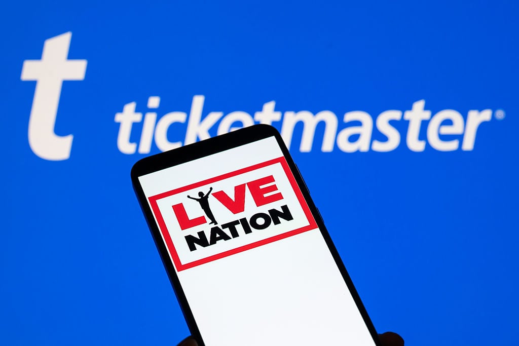The Live Nation logo is displayed on a mobile phone with Ticketmaster branding seen in the background in this photo illustration in Brussels, Belgium, on October 25, 2025. (Photo by Jonathan Raa/NurPhoto via Getty Images)